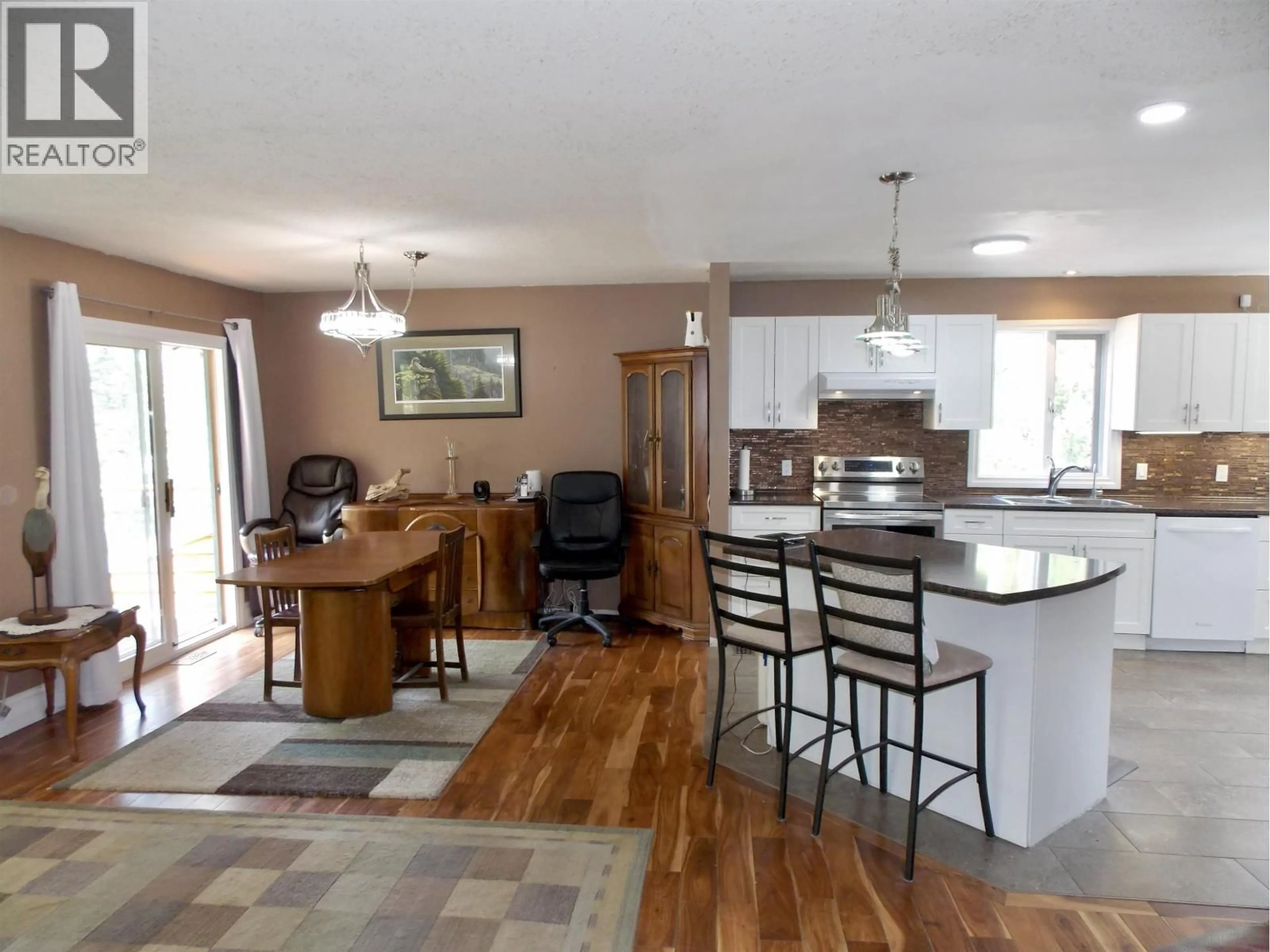 Open concept kitchen, wood/laminate floor for 1636 CAROLYN ROAD, Williams Lake British Columbia V2G4M1