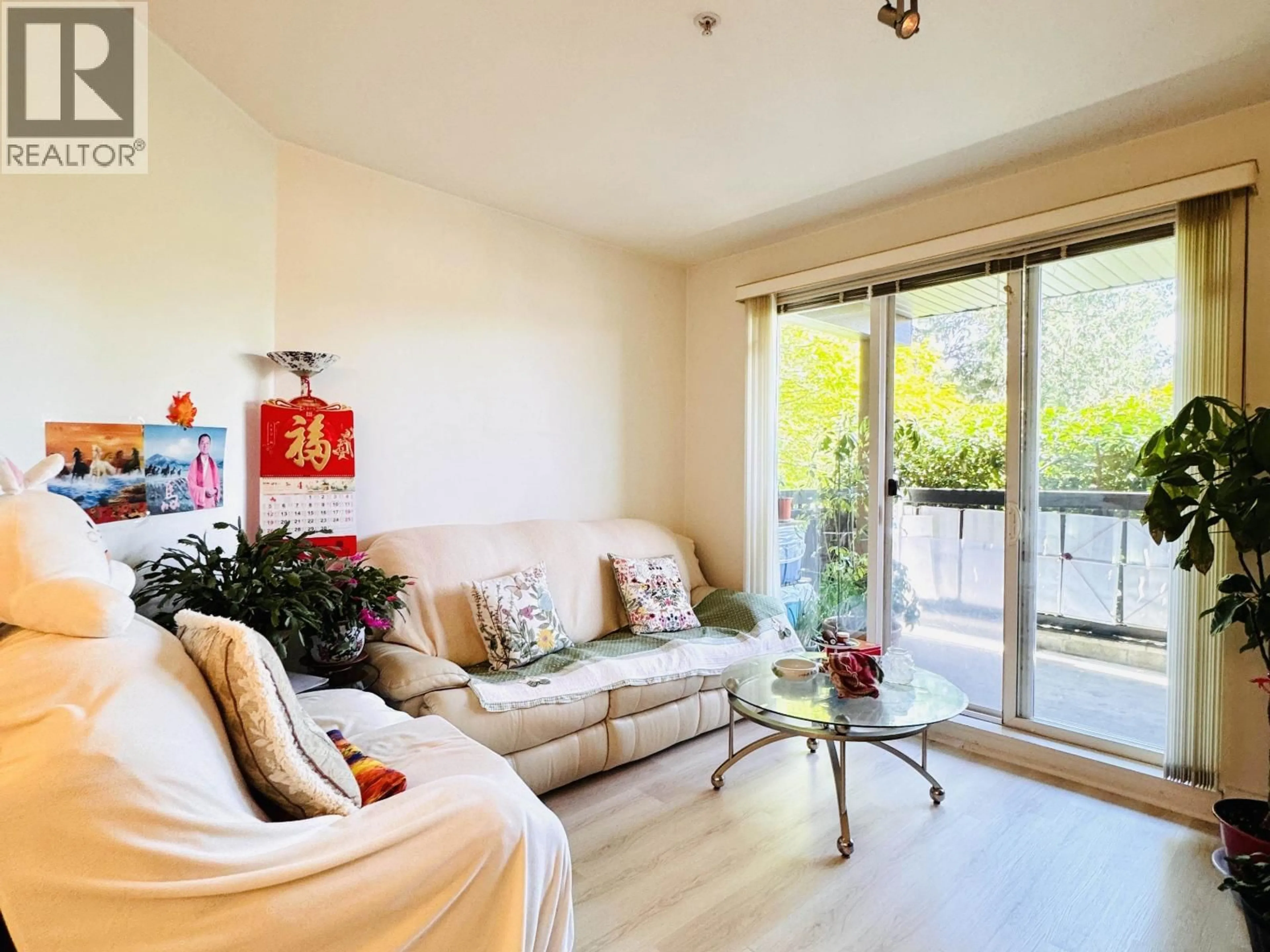 Living room with furniture, wood/laminate floor for 116 - 6033 KATSURA STREET, Richmond British Columbia V6Y0B3