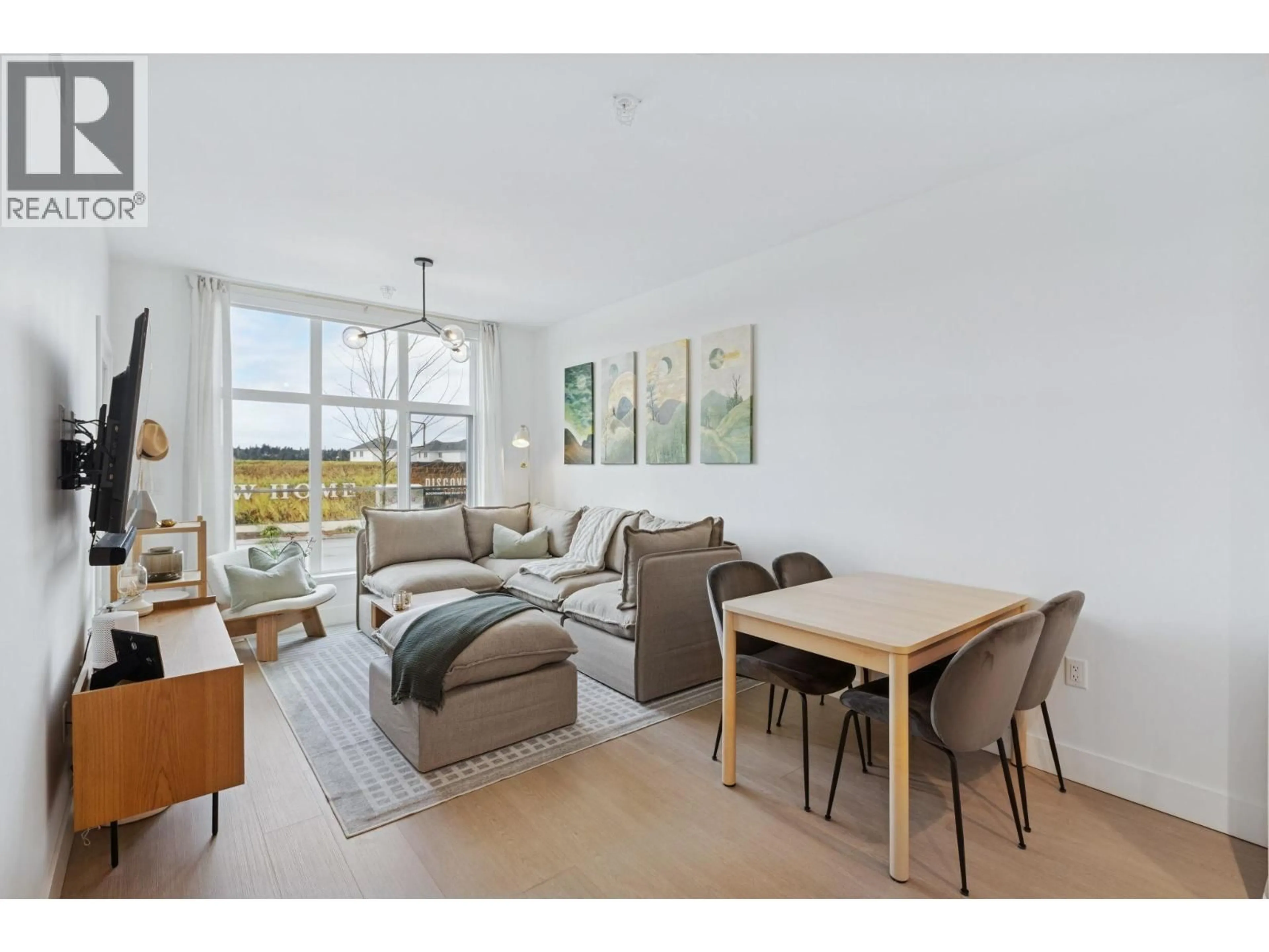 Living room with furniture, wood/laminate floor for 101 - 320 RIDGE STREET, Tsawwassen British Columbia V4L0B5