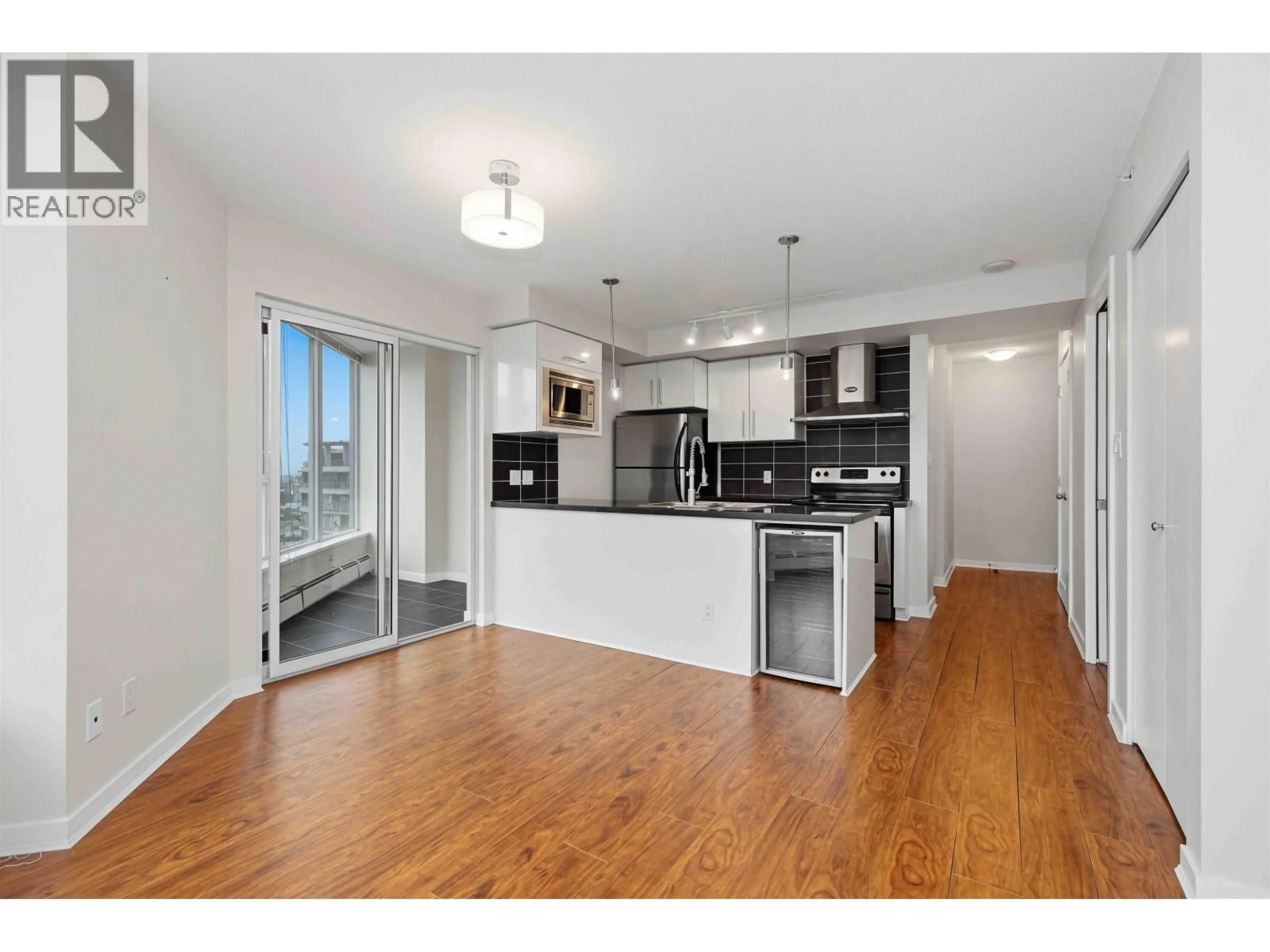 Open concept kitchen, wood/laminate floor for 2901 - 689 ABBOTT STREET, Vancouver British Columbia V6B0J2