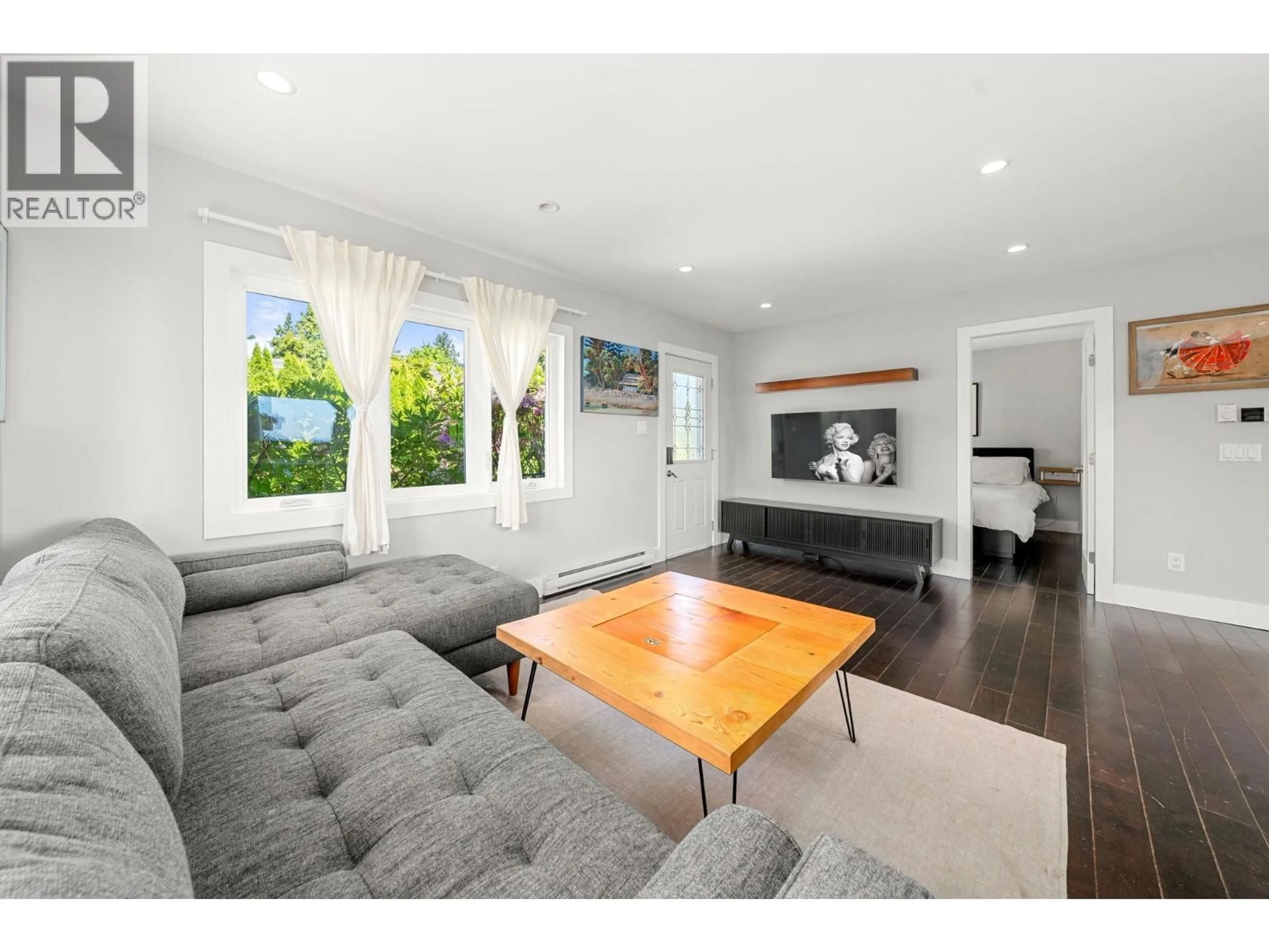 Living room with furniture, wood/laminate floor for 803 CALVERHALL STREET, North Vancouver British Columbia V7L1X8