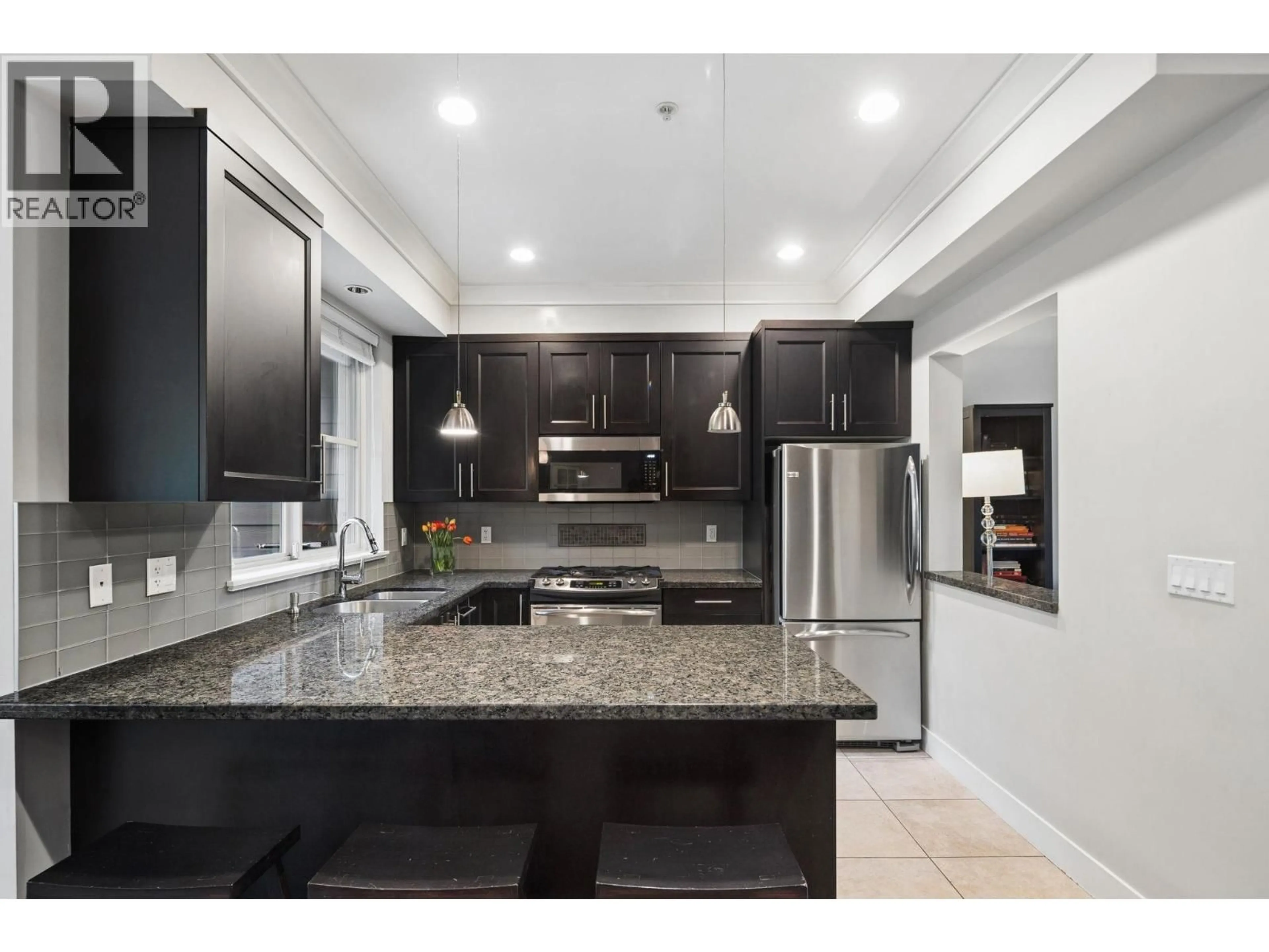 Open concept kitchen, ceramic/tile floor for 2 - 3025 BAIRD ROAD, North Vancouver British Columbia V7K2G5