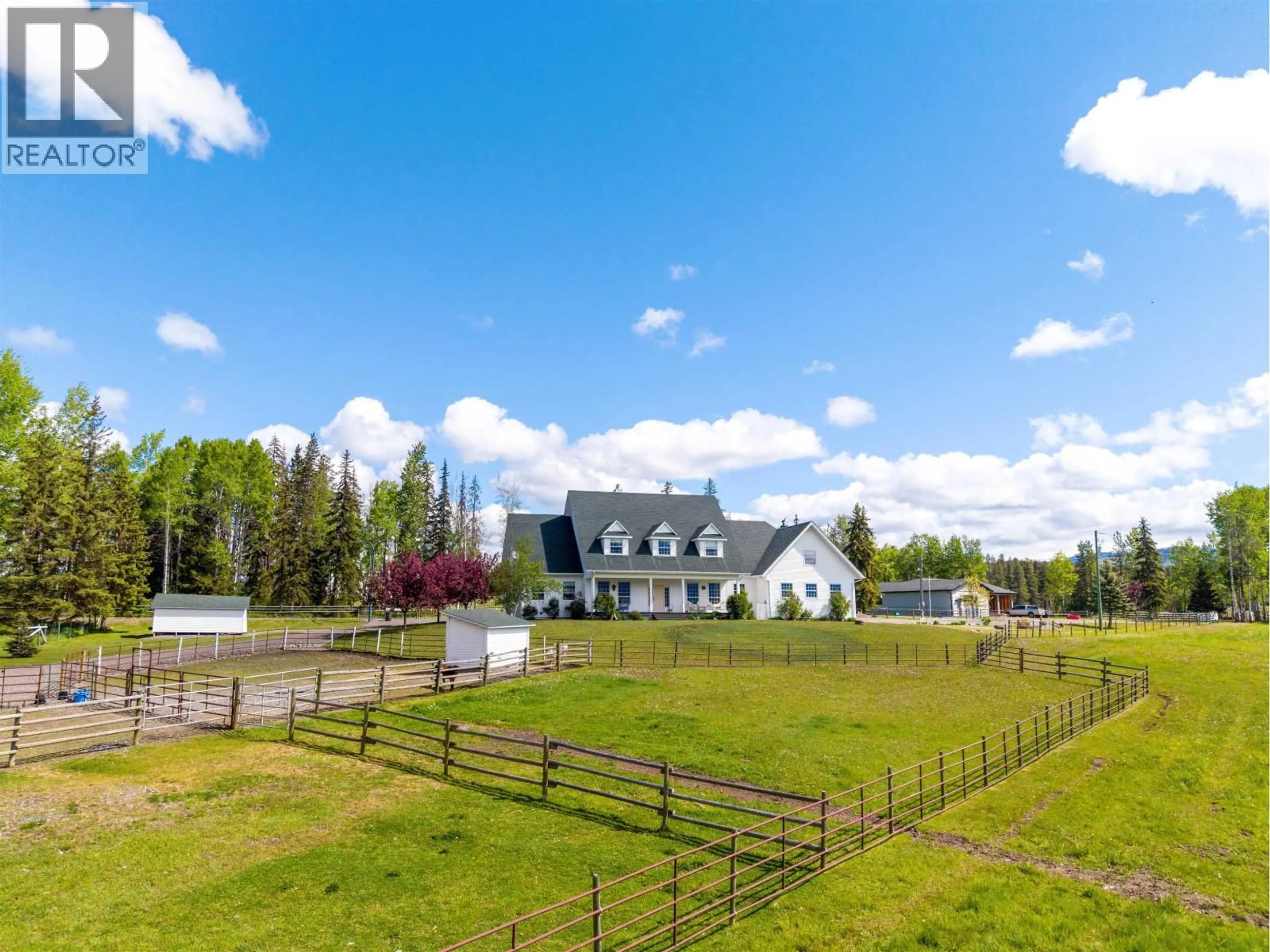 A pic from outside/outdoor area/front of a property/back of a property/a pic from drone, mountain view for 9146 ENGMAN ROAD, Smithers British Columbia V0J2N1