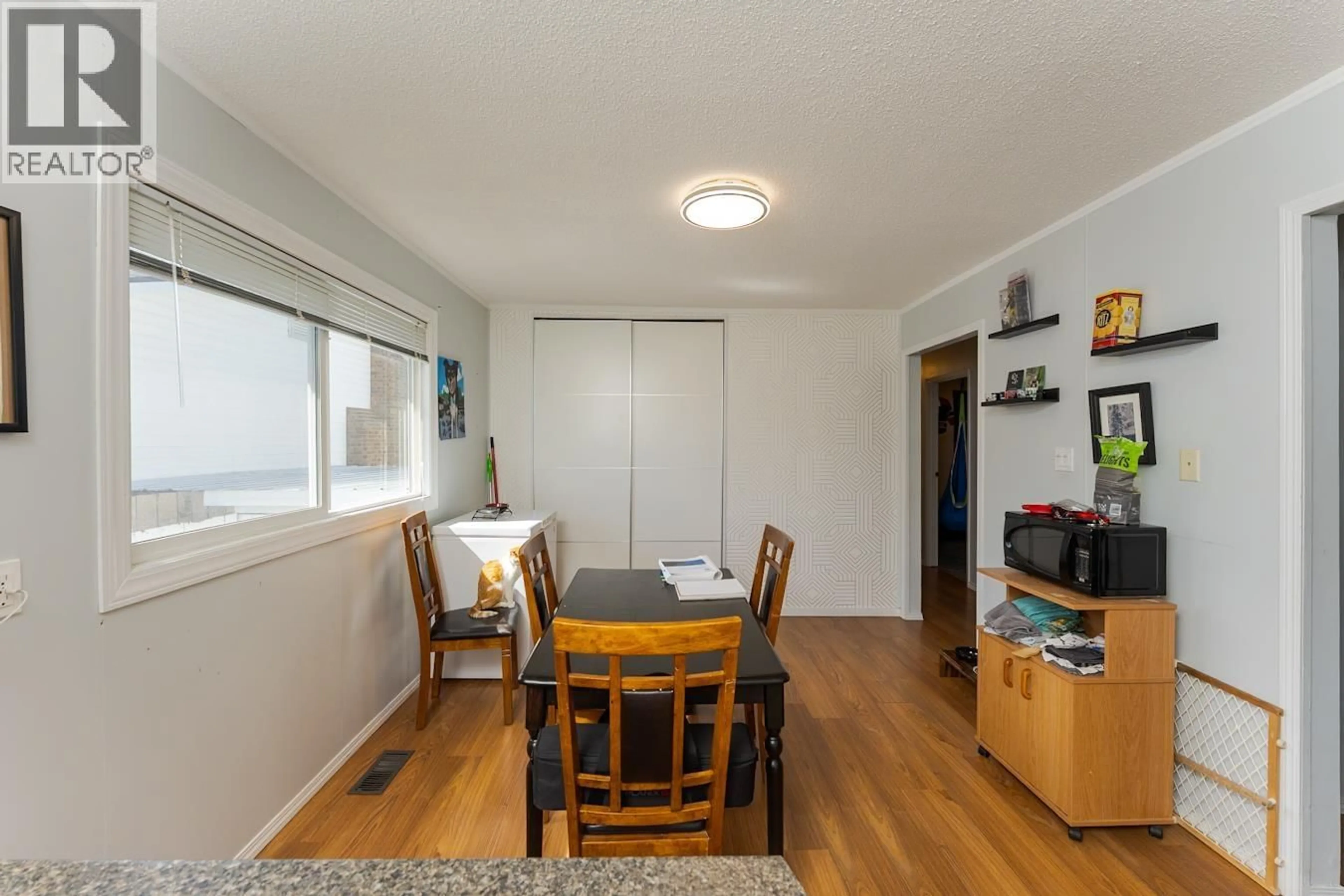 Dining room, wood/laminate floor for 1086 LIMESTONE CRESCENT, Prince George British Columbia V2M4Z2