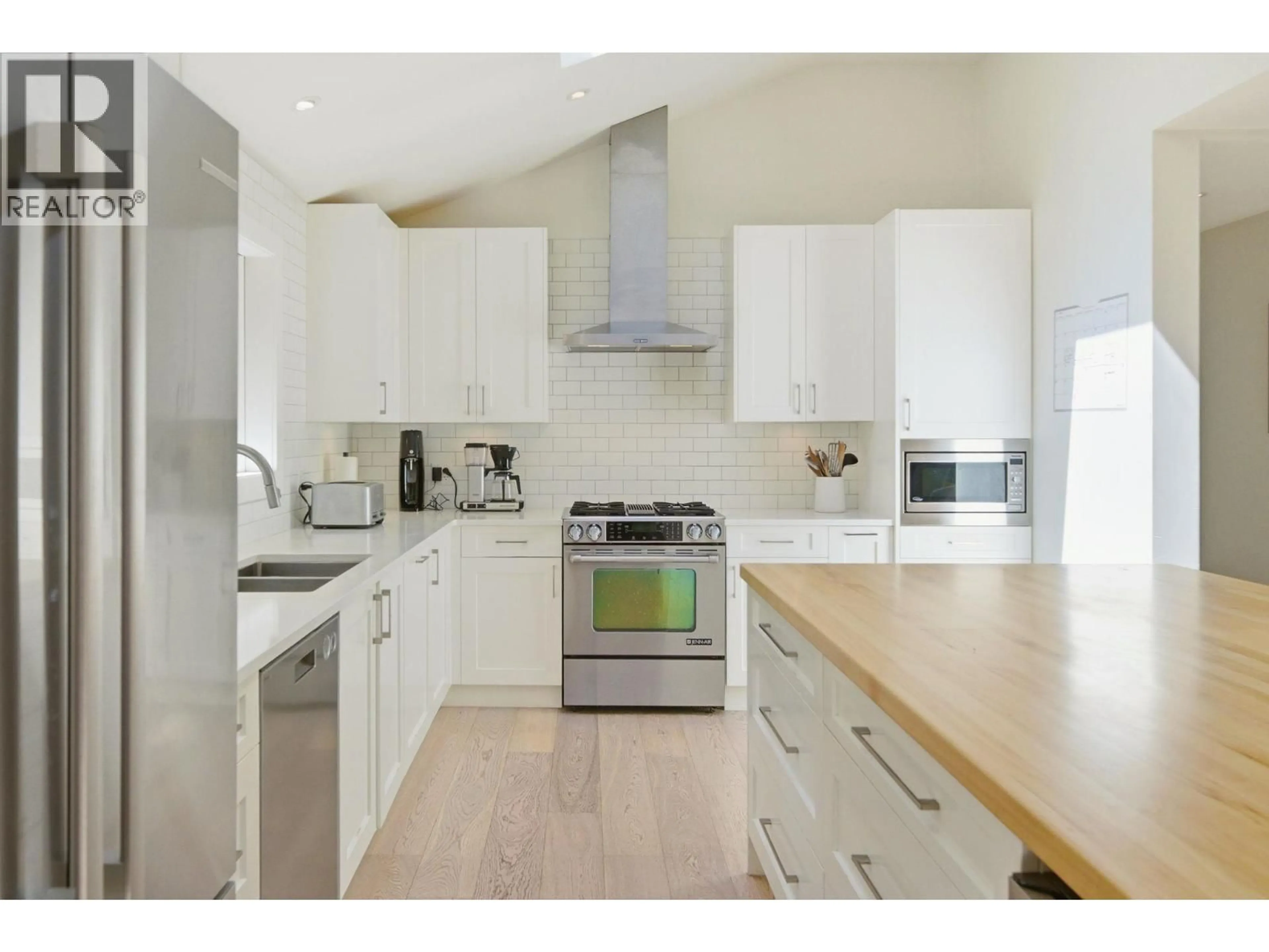 Open concept kitchen, wood/laminate floor for 5222 SARITA AVENUE, North Vancouver British Columbia V7R3M9