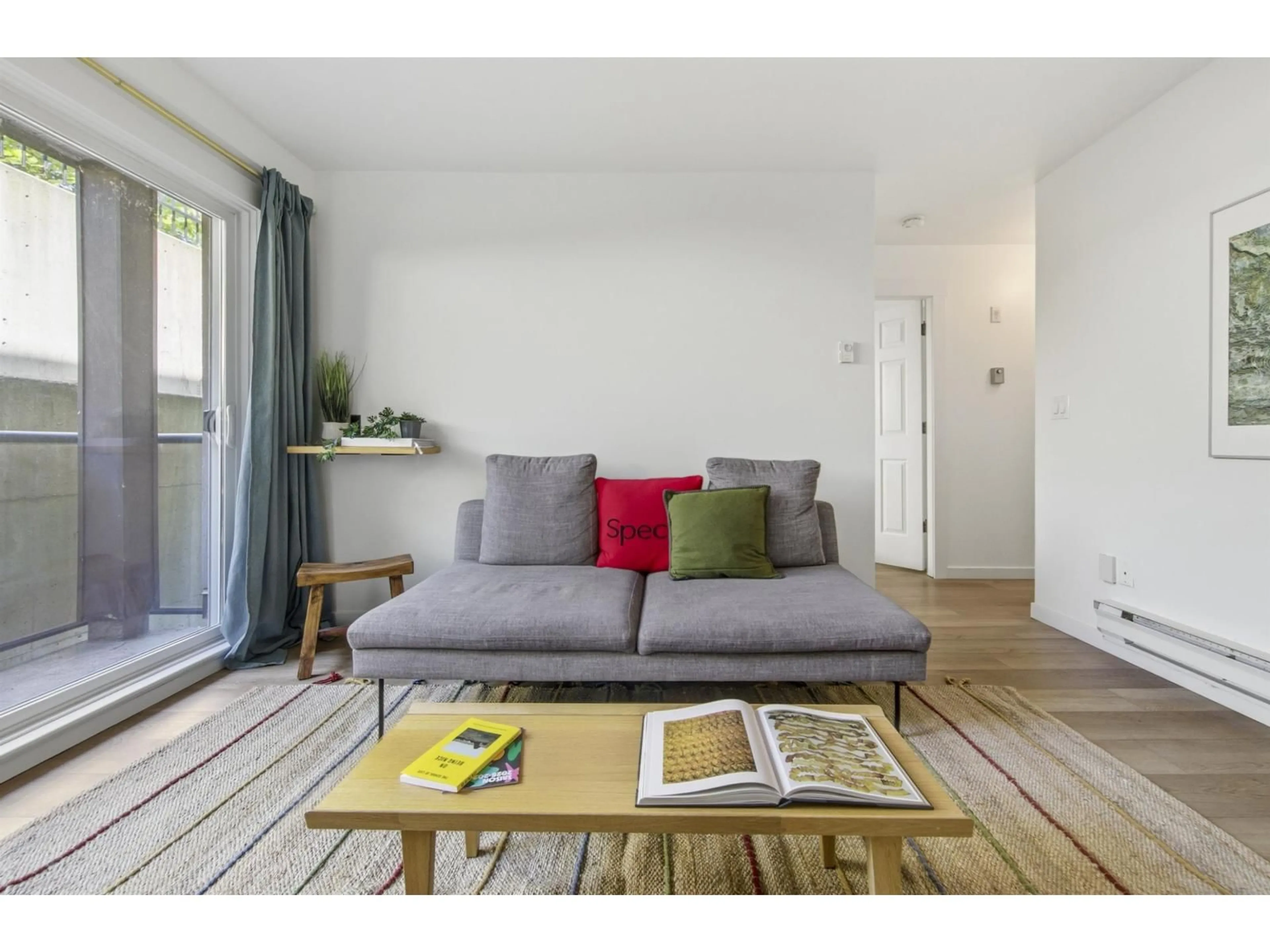 Living room with furniture, wood/laminate floor for 205 - 33165 2ND AVENUE, Mission British Columbia V2V6T8