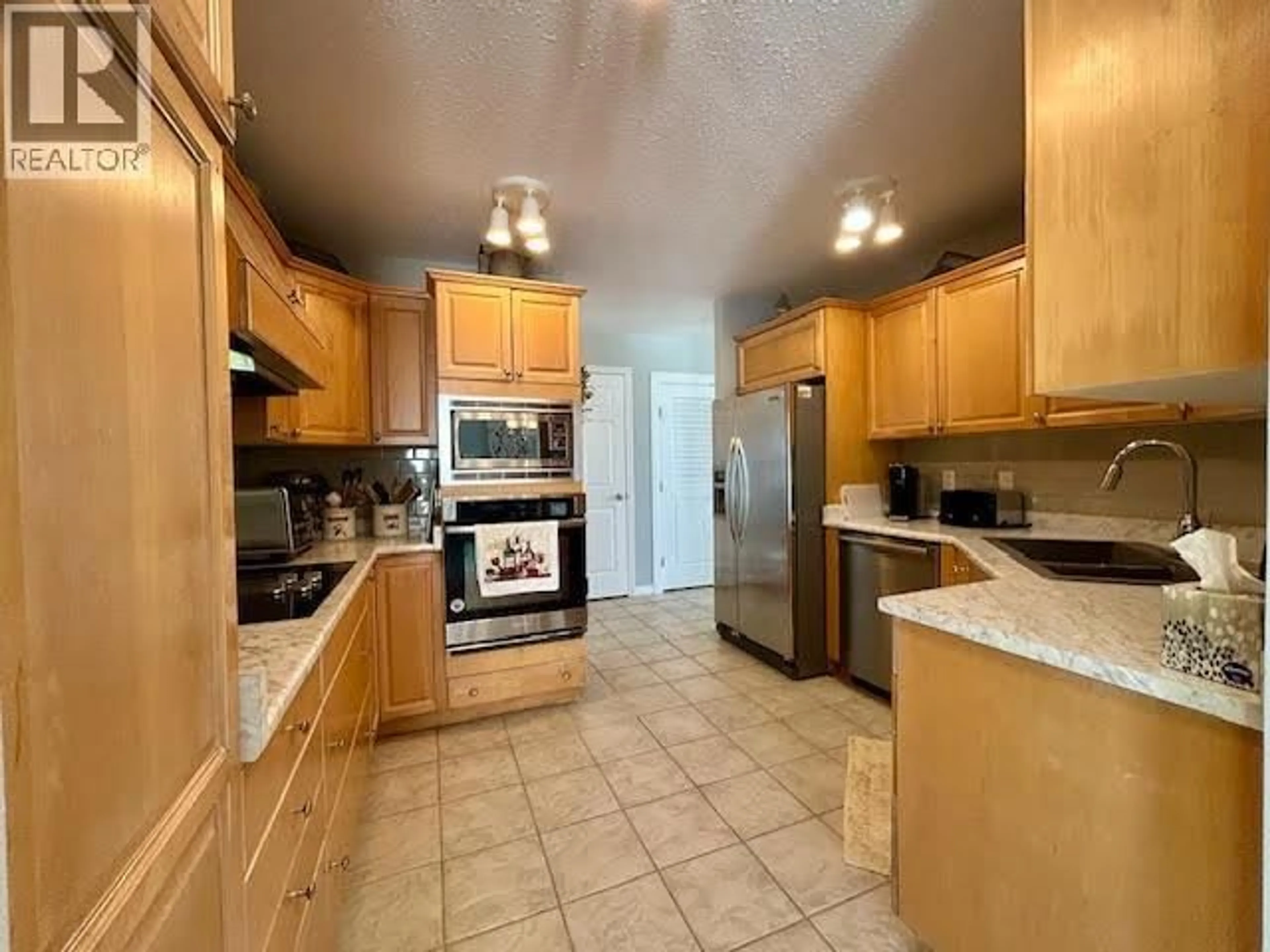 Standard kitchen, ceramic/tile floor for 5515 57 AVENUE, Fort Nelson British Columbia V0C1R0