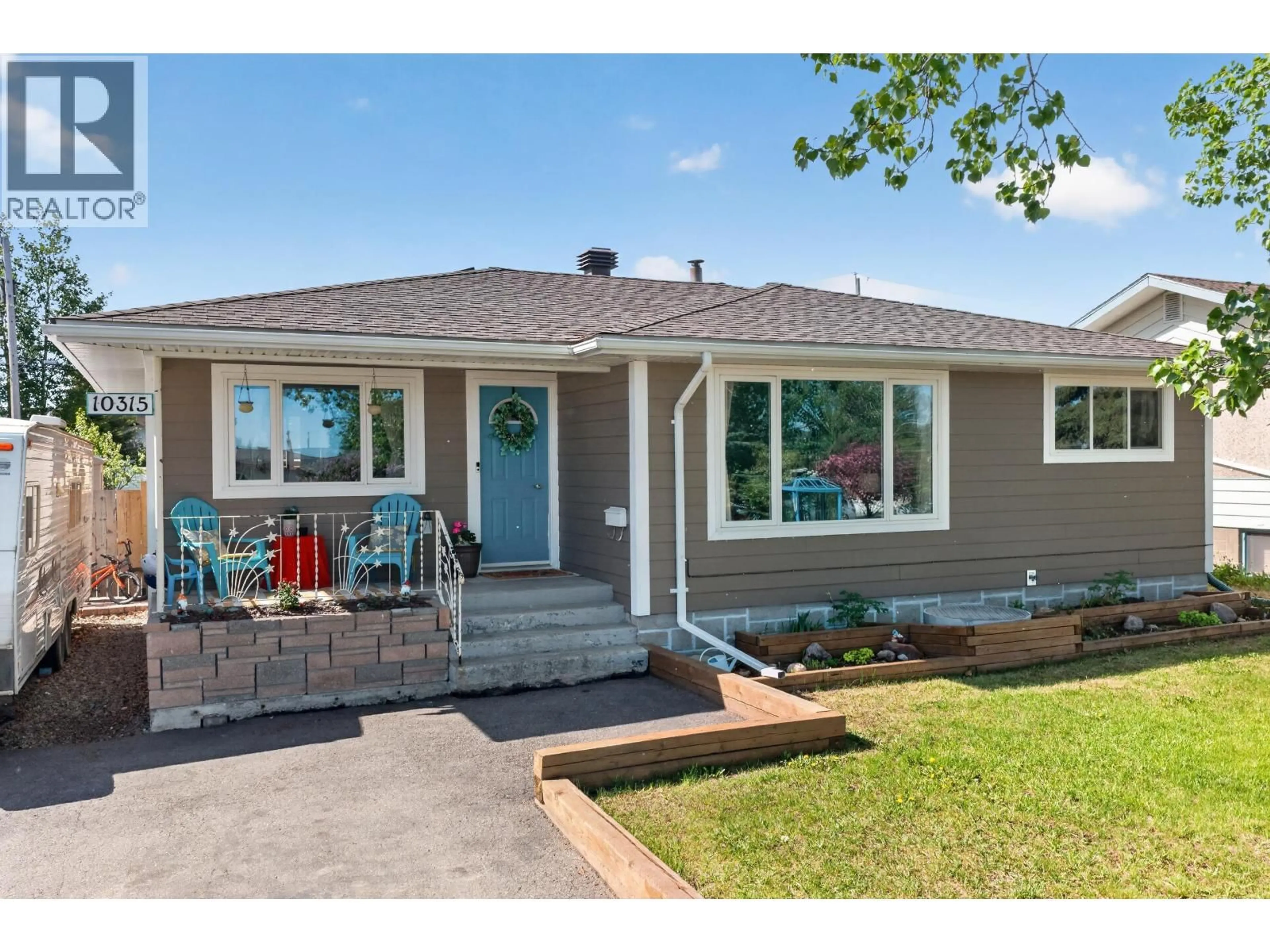 Home with vinyl exterior material, street for 10315 111 AVENUE, Fort St. John British Columbia V1J2V3