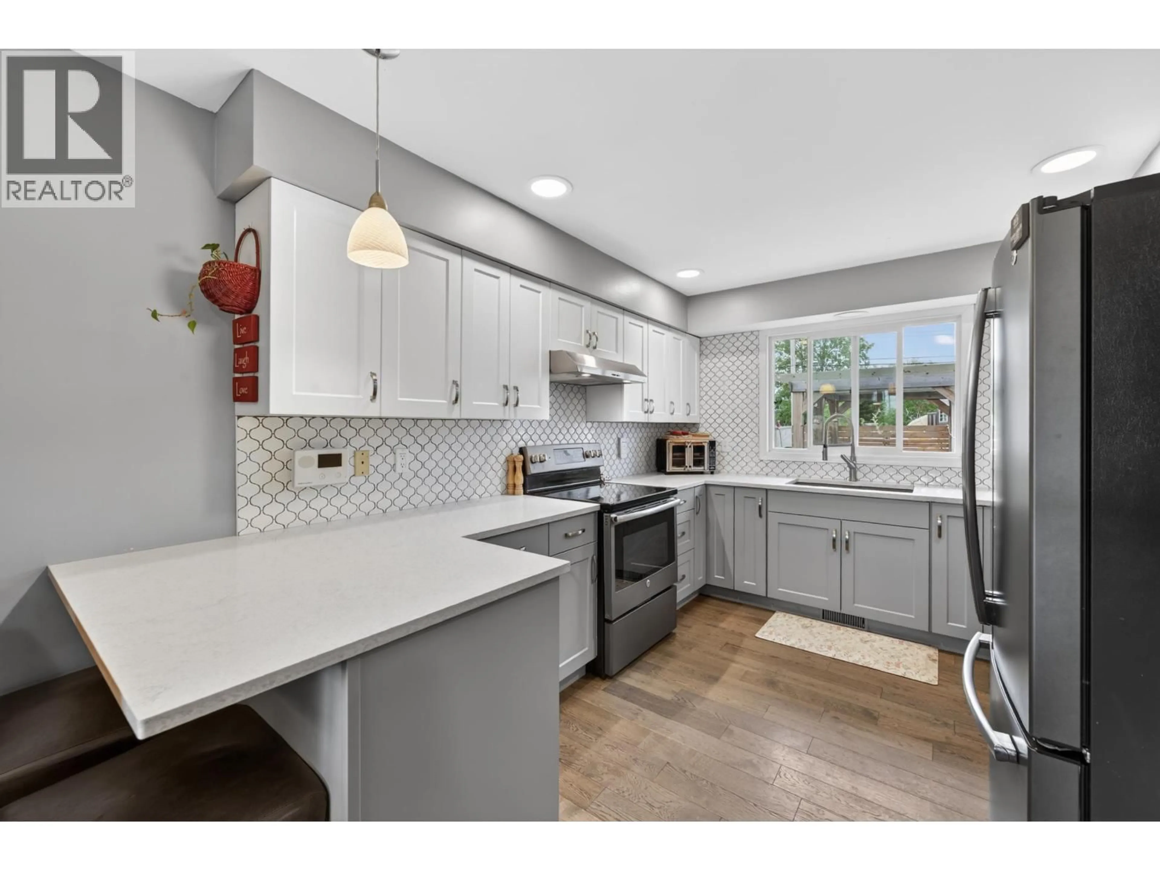 Open concept kitchen, ceramic/tile floor for 10315 111 AVENUE, Fort St. John British Columbia V1J2V3