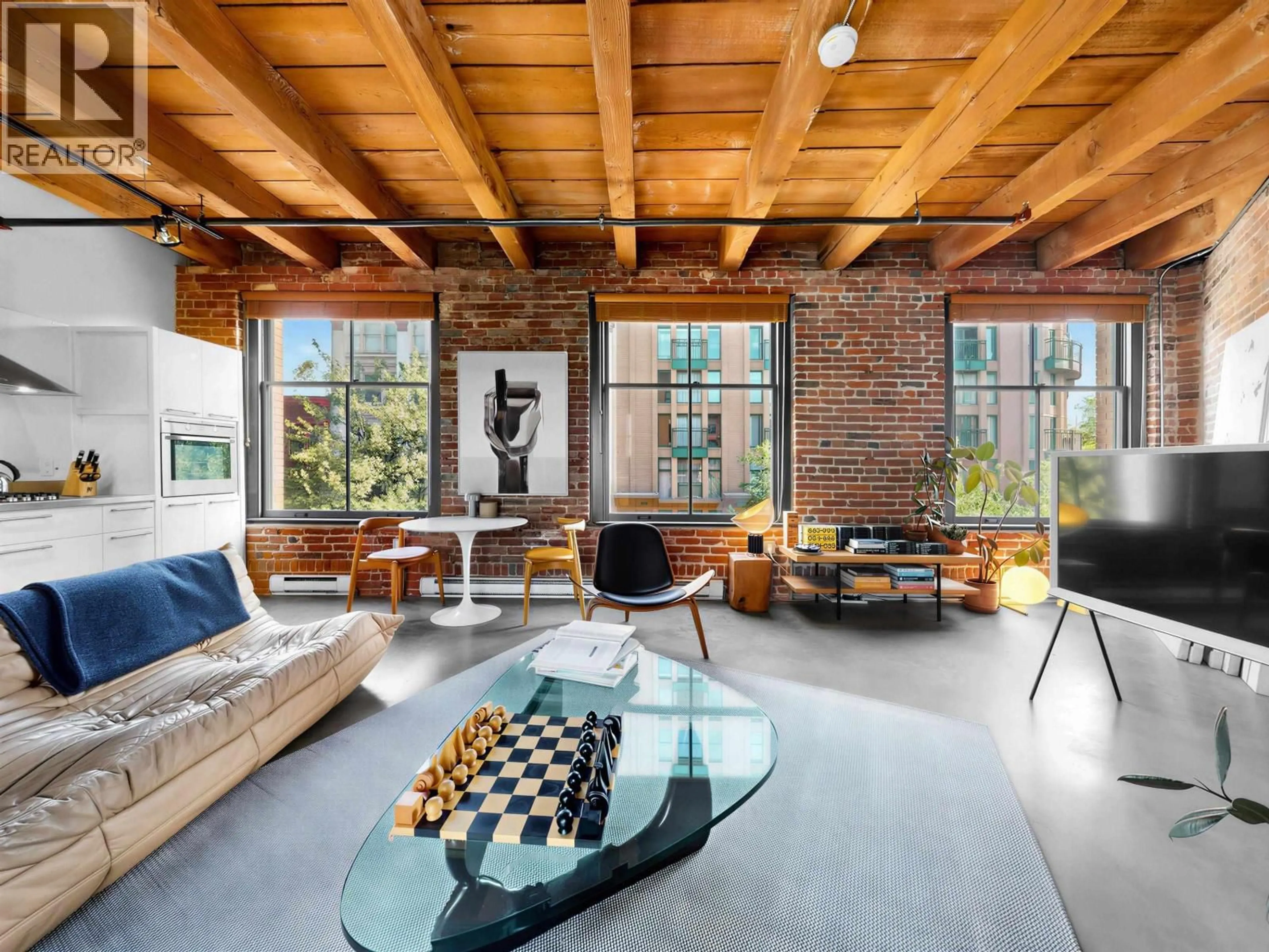 Living room with furniture, cement floor for 321 - 55 CORDOVA STREET, Vancouver British Columbia V6A0A5
