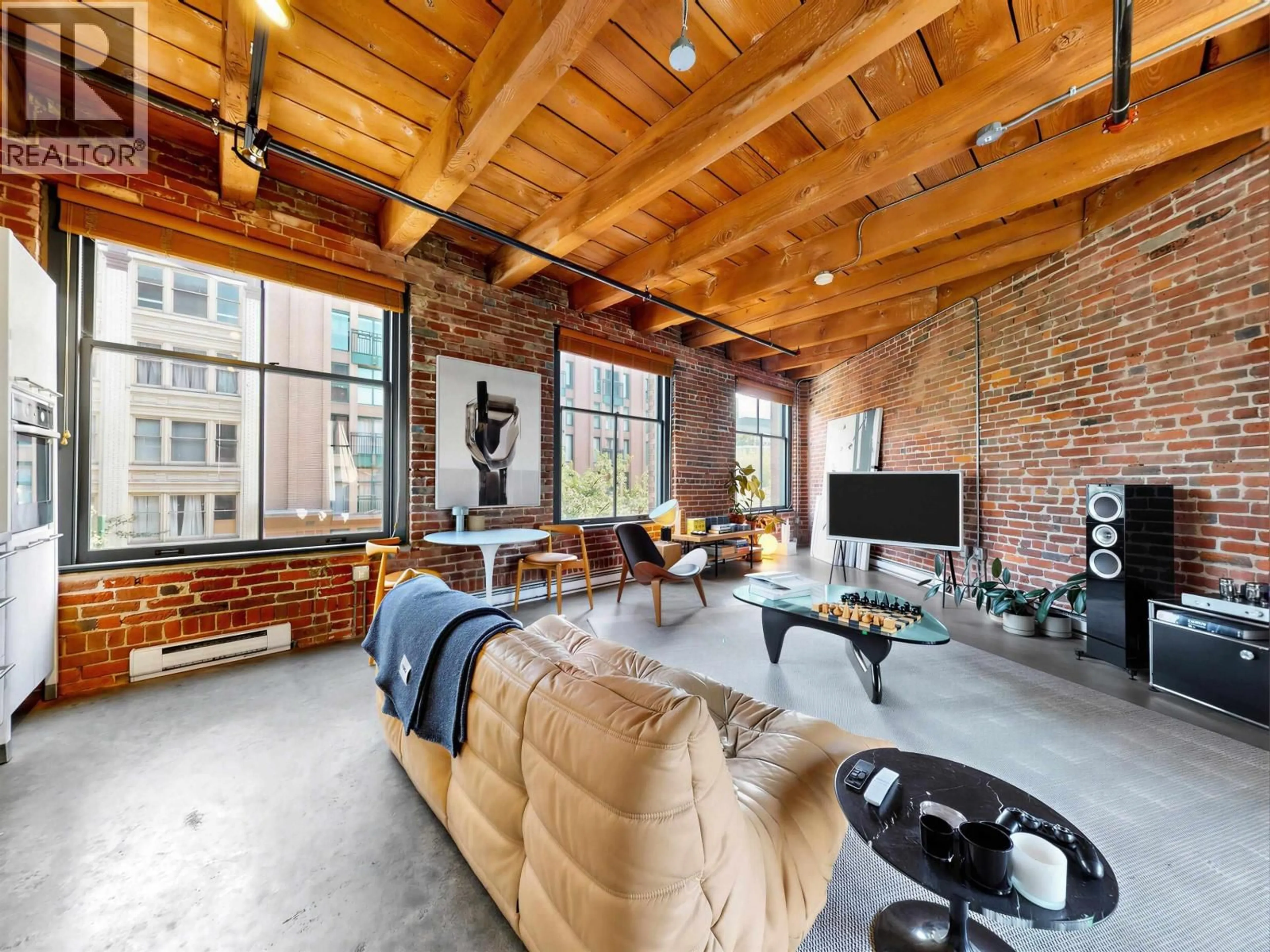 Living room with furniture, cement floor for 321 - 55 CORDOVA STREET, Vancouver British Columbia V6A0A5