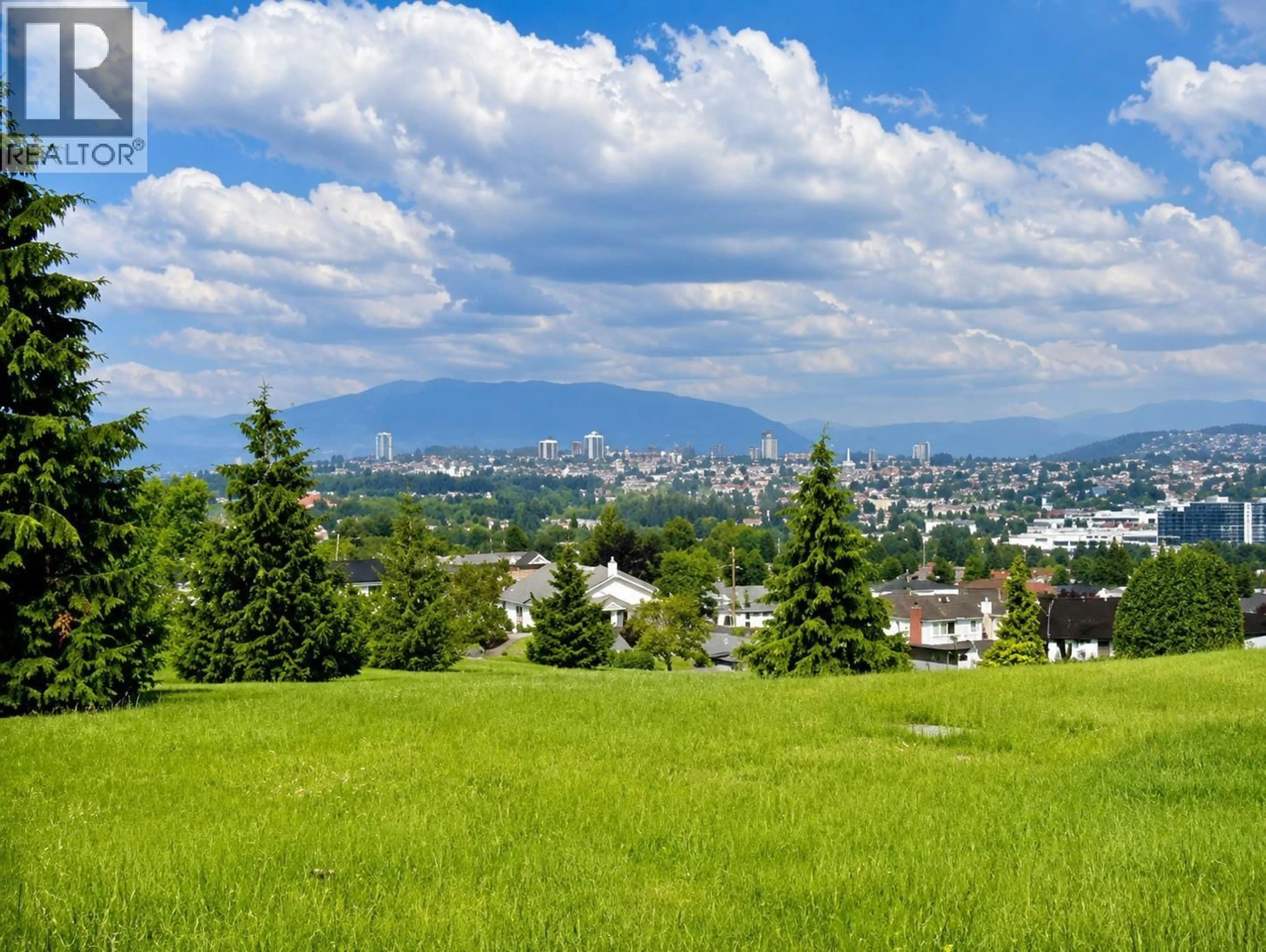 A pic from outside/outdoor area/front of a property/back of a property/a pic from drone, mountain view for 3141 BROADWAY, Vancouver British Columbia V5M1Z7