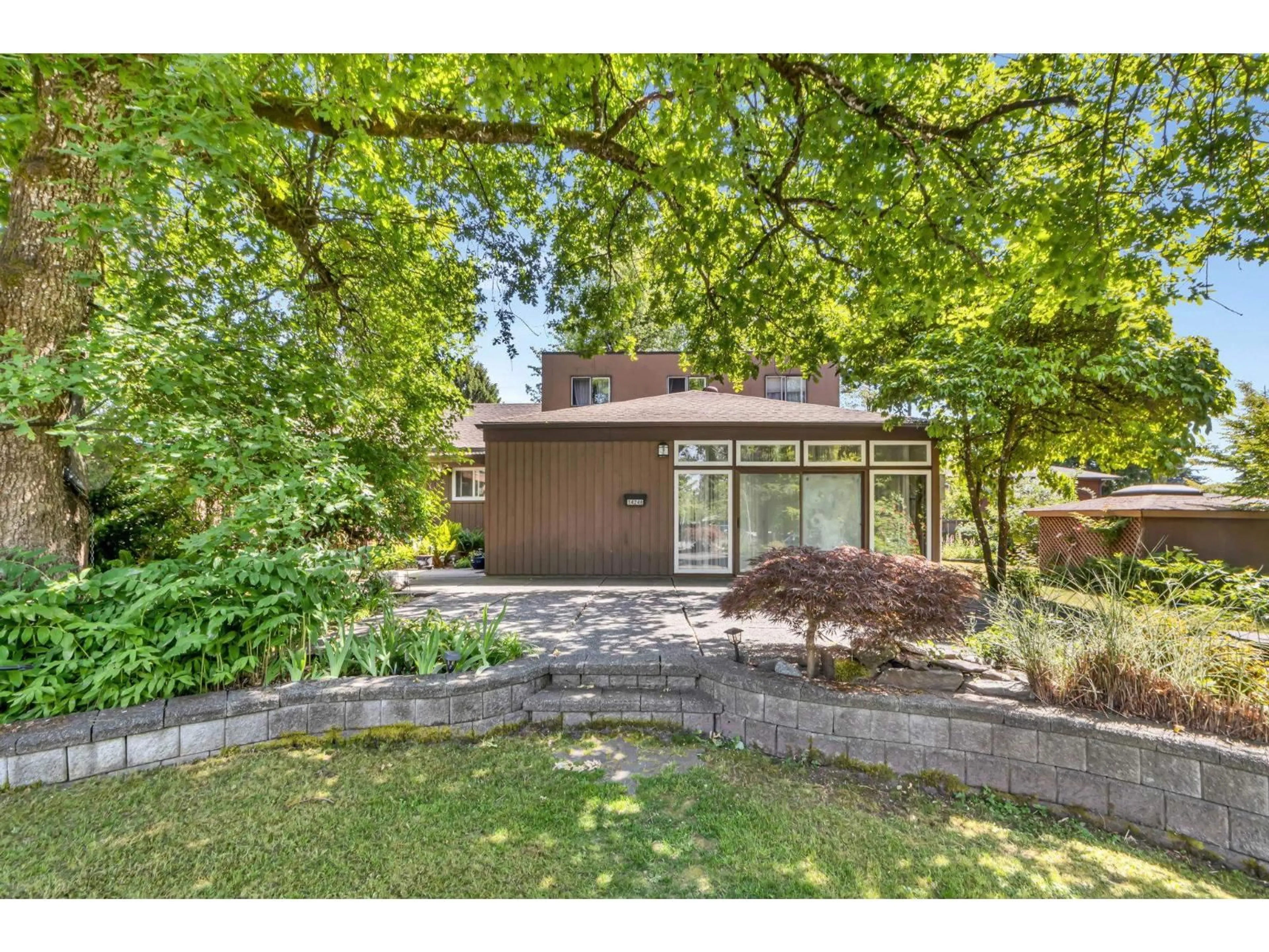 A pic from outside/outdoor area/front of a property/back of a property/a pic from drone, street for 14246 102 AVENUE, Surrey British Columbia V3T5A5