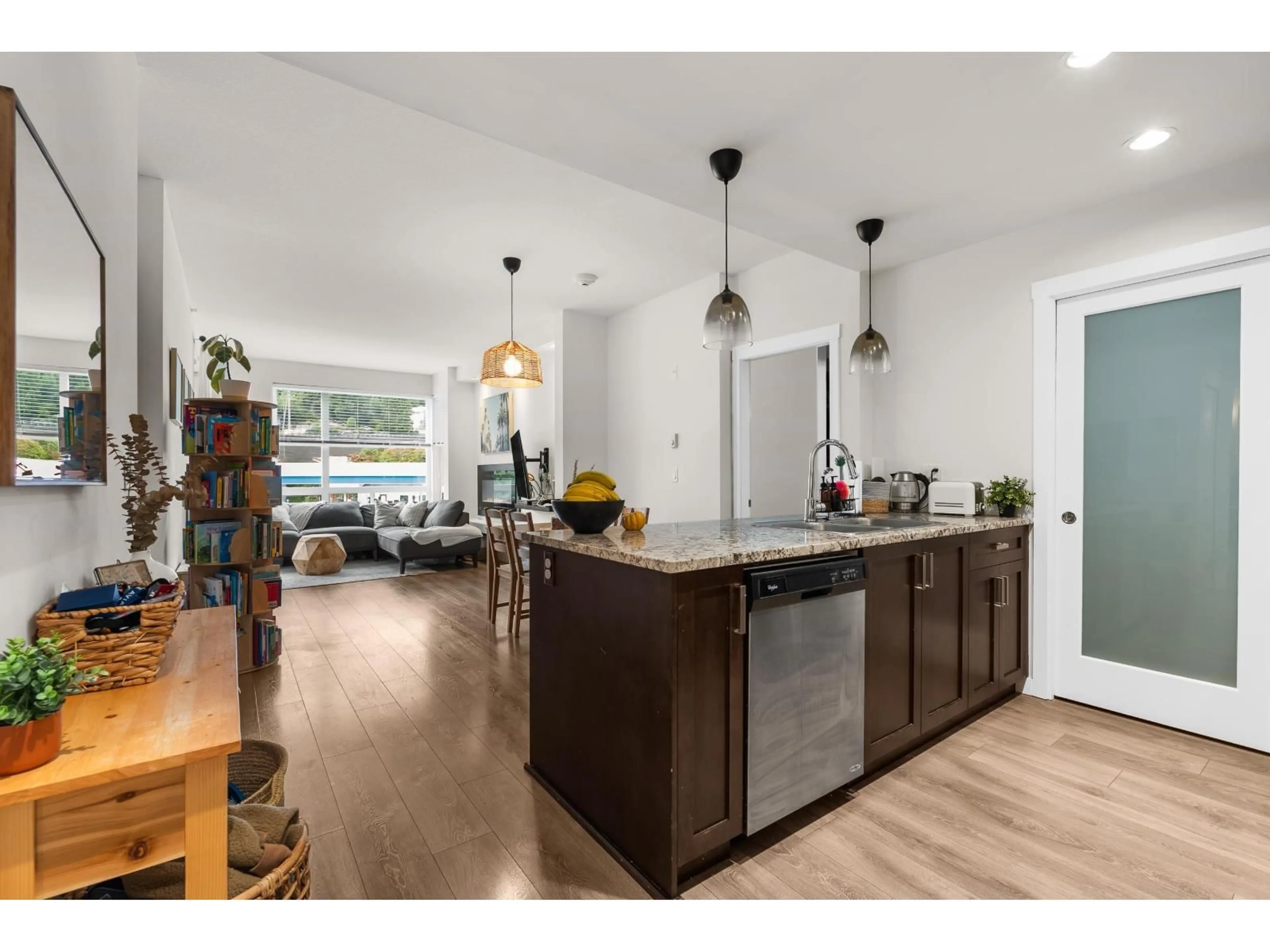 Open concept kitchen, wood/laminate floor for 406 - 2242 WHATCOM ROAD, Abbotsford British Columbia V3G0G3