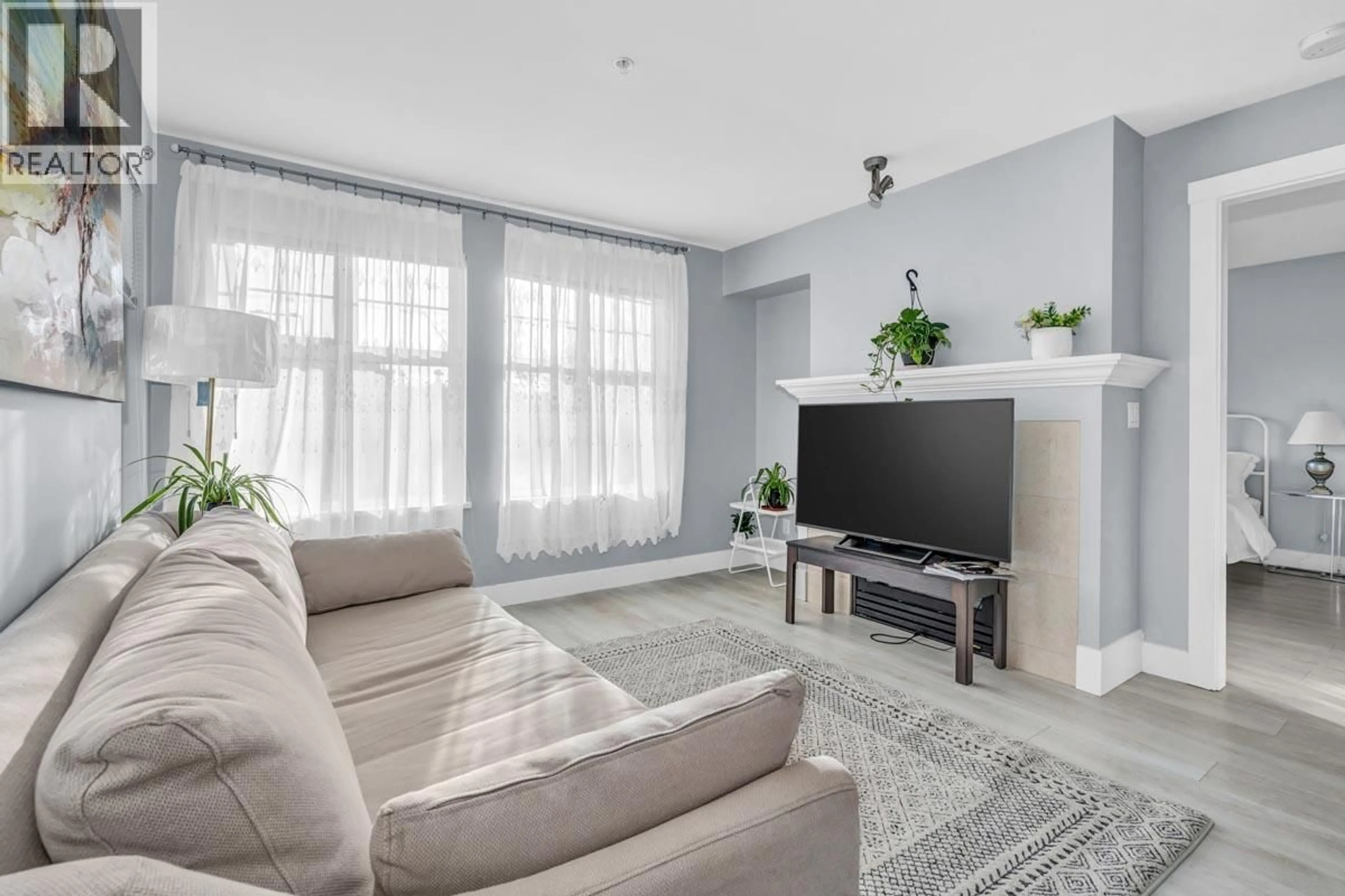 Living room with furniture, unknown for 210 - 995 59TH AVENUE, Vancouver British Columbia V6P6Z2