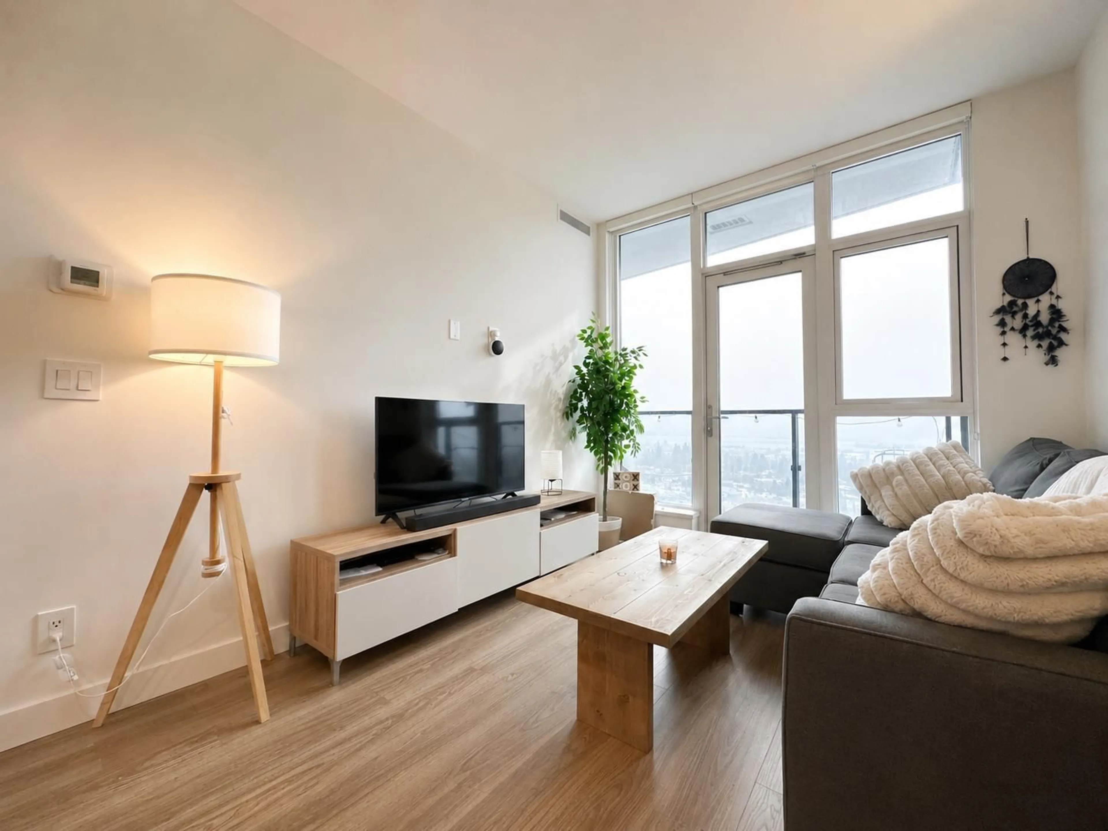 Living room with furniture, wood/laminate floor for 2301 - 10750 135A STREET, Surrey British Columbia V3T0V4