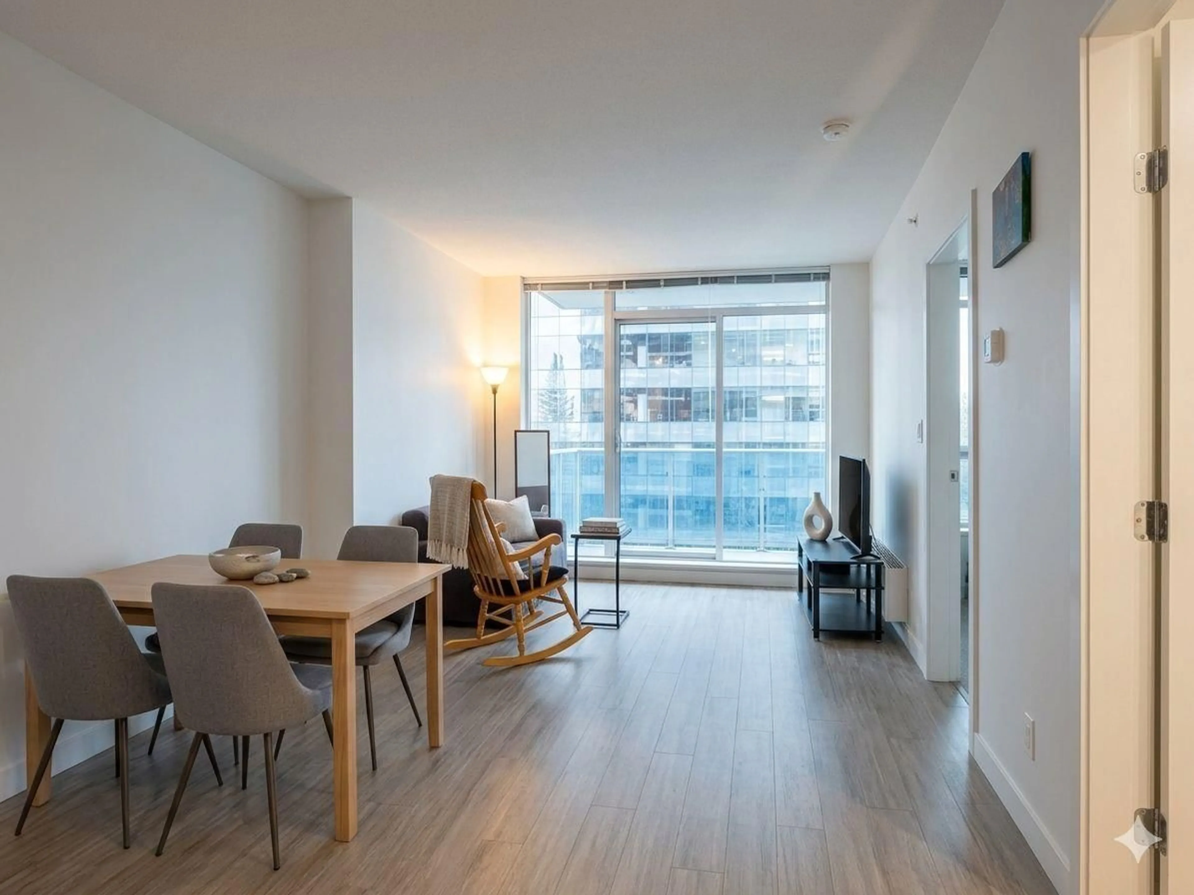 Living room with furniture, wood/laminate floor for 1308 - 13615 FRASER HIGHWAY, Surrey British Columbia V3T0P7