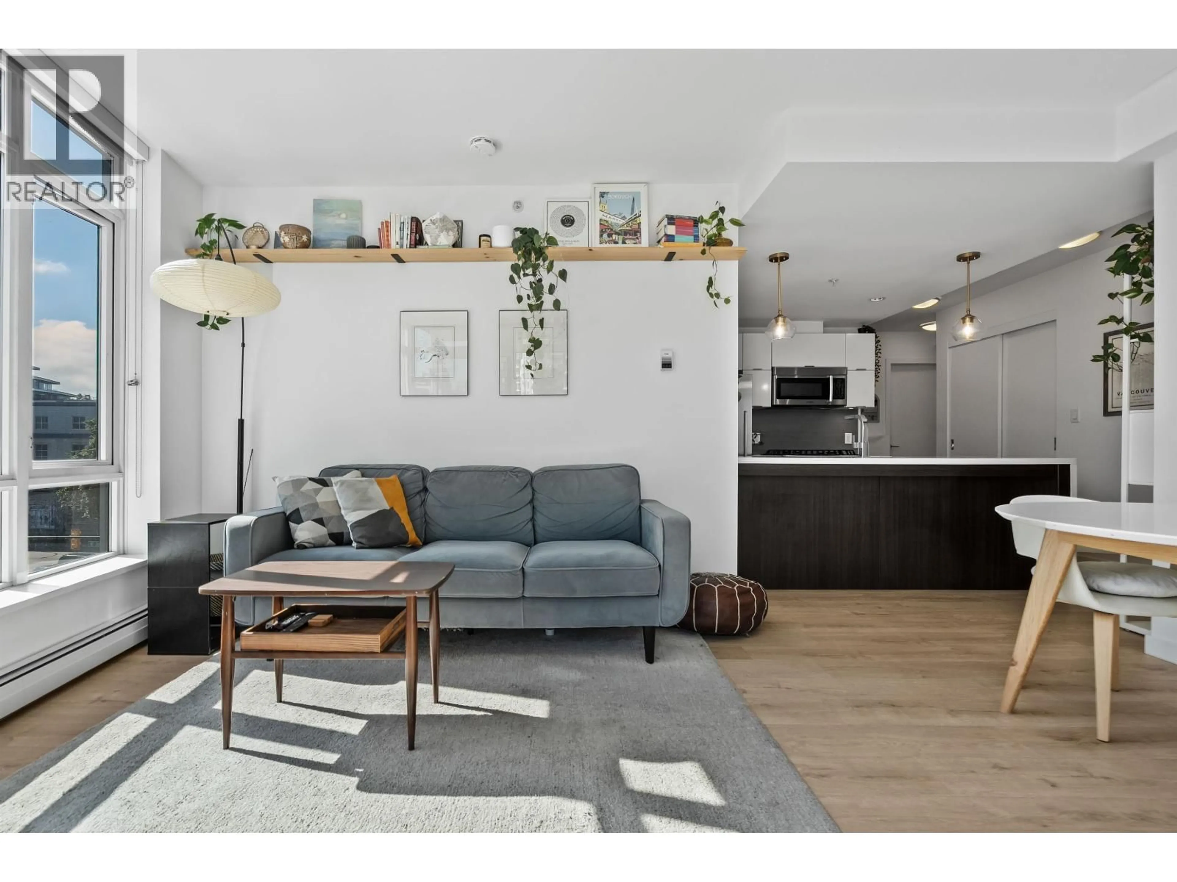 Living room with furniture, wood/laminate floor for 503 - 1775 QUEBEC STREET, Vancouver British Columbia V5T0E3