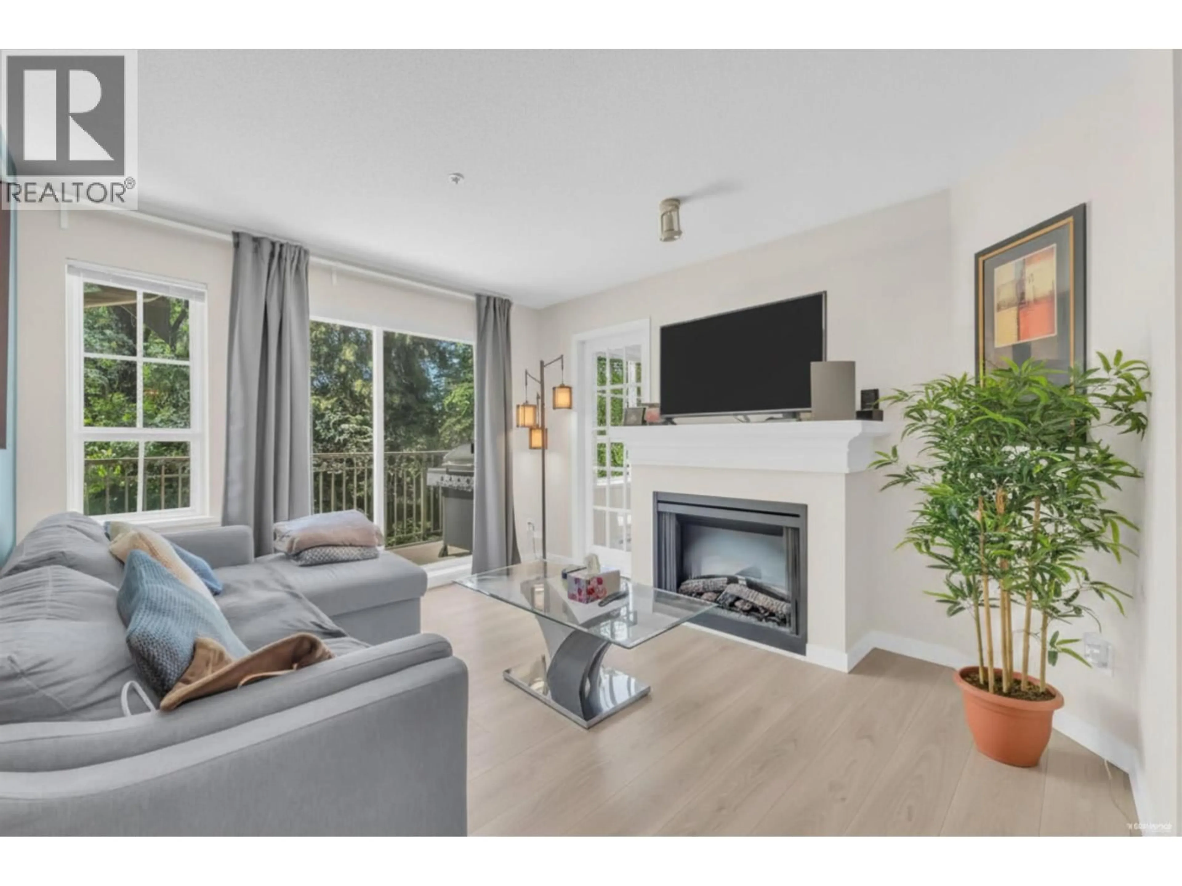 Living room with furniture, wood/laminate floor for 411 - 3388 MORREY COURT, Burnaby British Columbia V3J7Y5