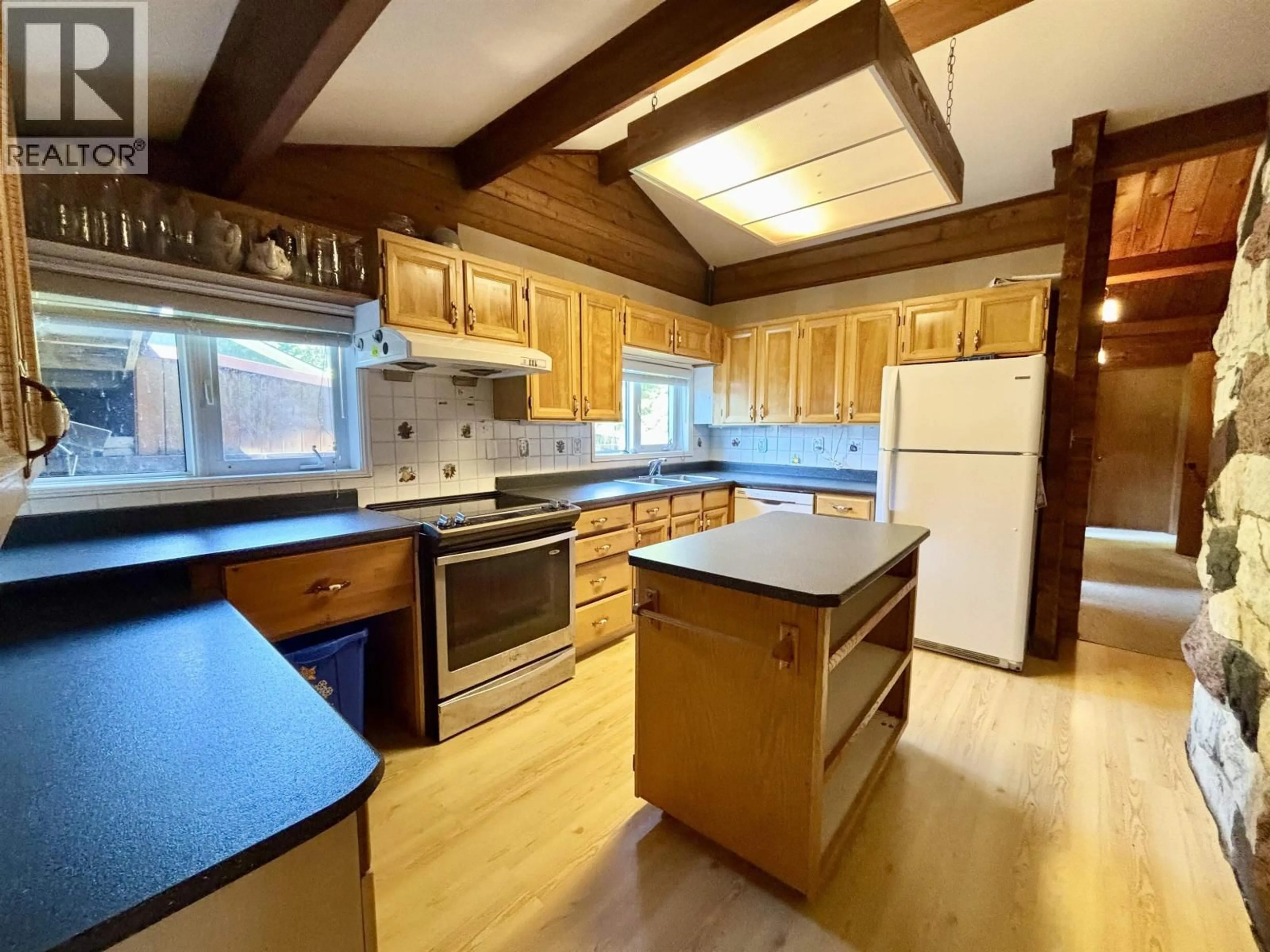 Open concept kitchen, wood/laminate floor for 41 AMOS STREET, Kitimat British Columbia V8C1A5