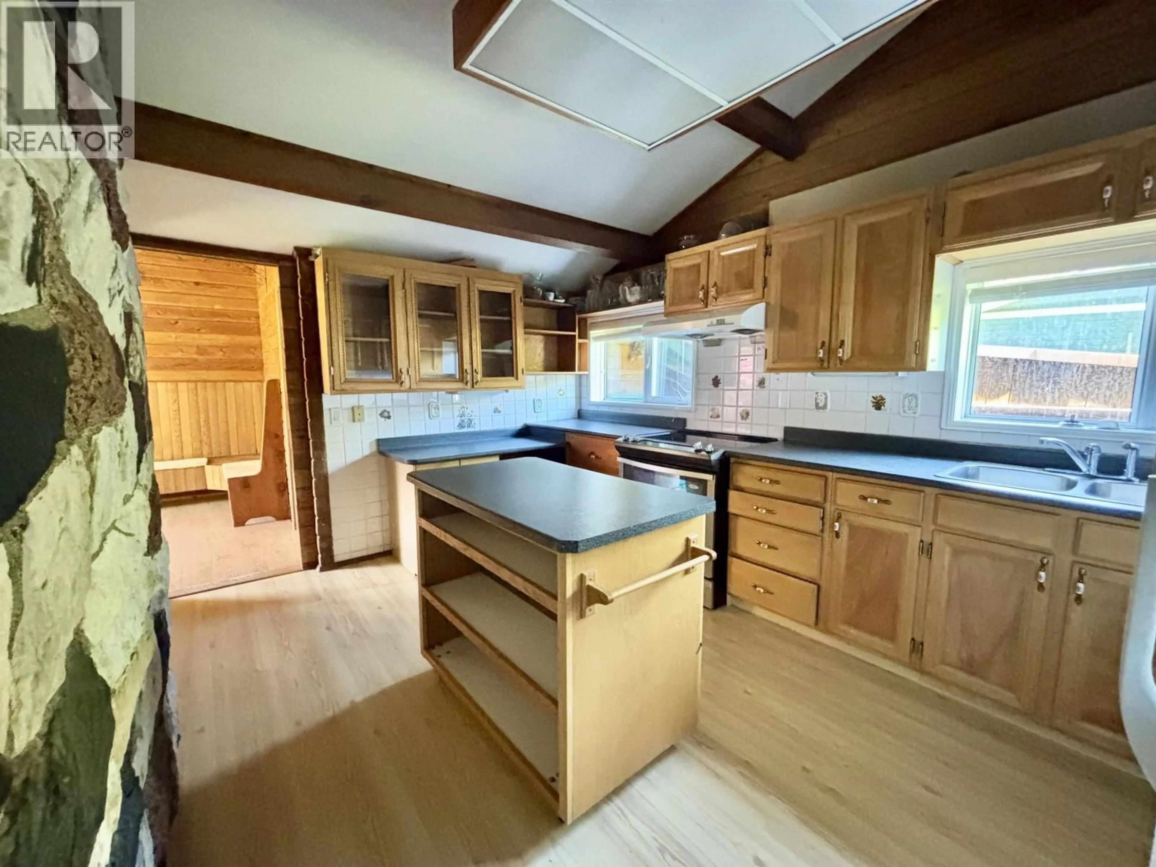 Open concept kitchen, wood/laminate floor for 41 AMOS STREET, Kitimat British Columbia V8C1A5