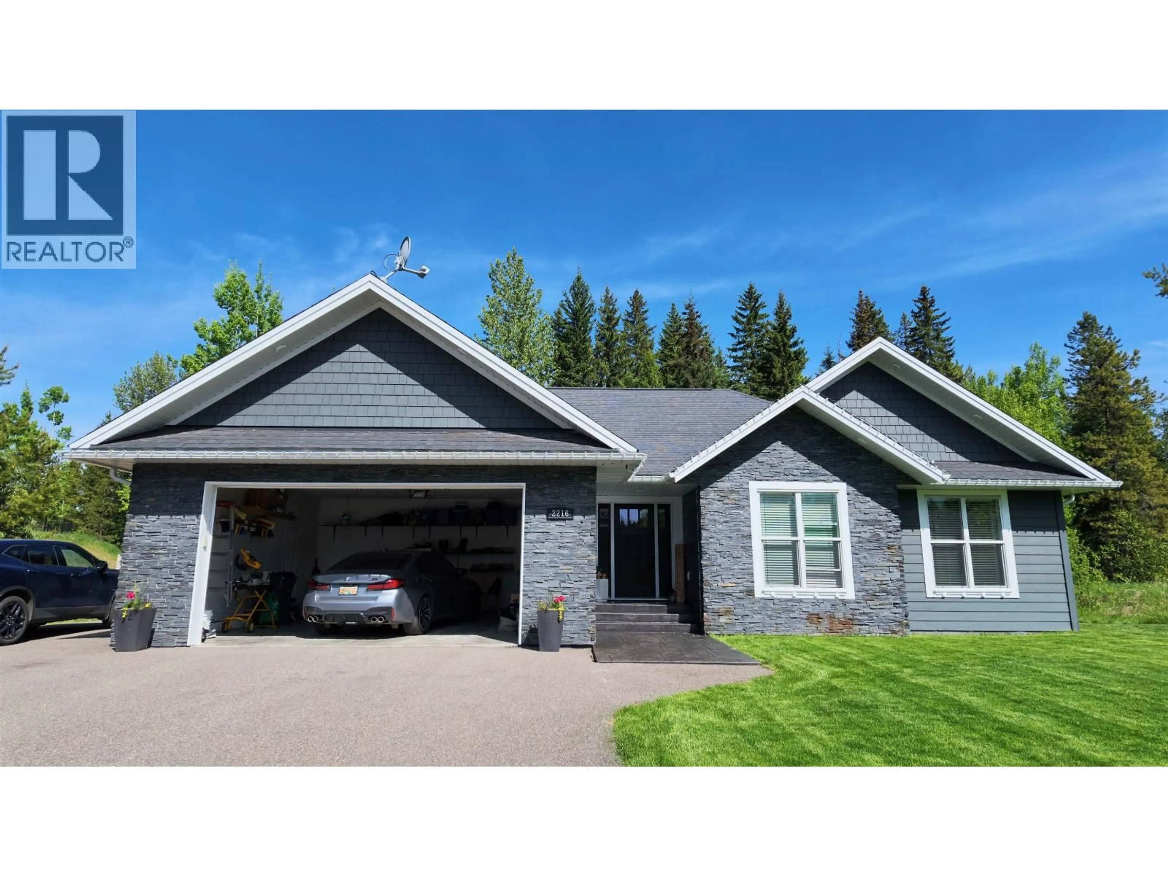 Home with vinyl exterior material, street for 2216 MCTAVISH ROAD, Prince George British Columbia V2K5R5