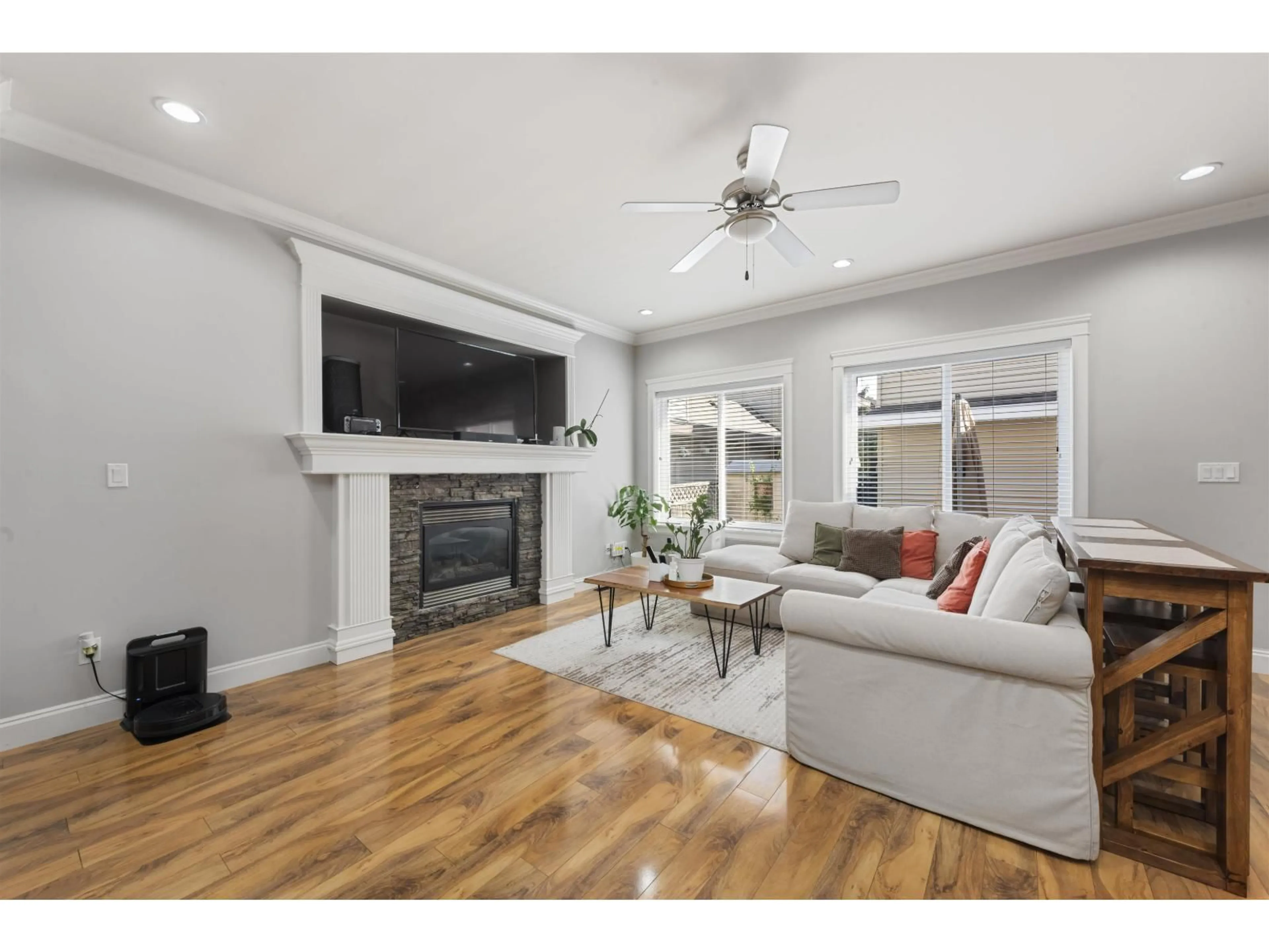 Living room with furniture, wood/laminate floor for 15032 60 AVENUE, Surrey British Columbia V3S5X6