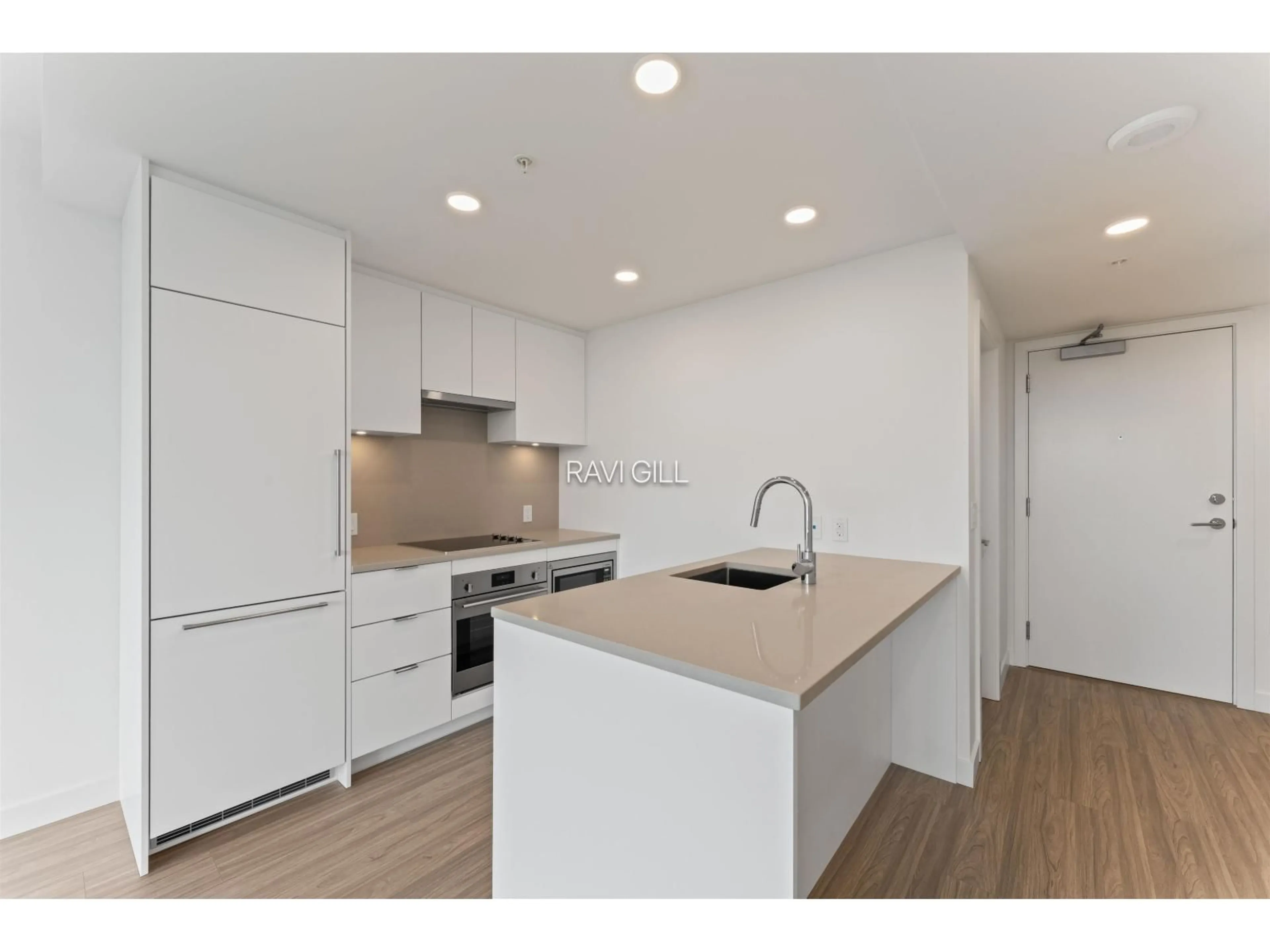 Open concept kitchen, wood/laminate floor for 2609 - 13675 107A AVENUE, Surrey British Columbia V3T0X3