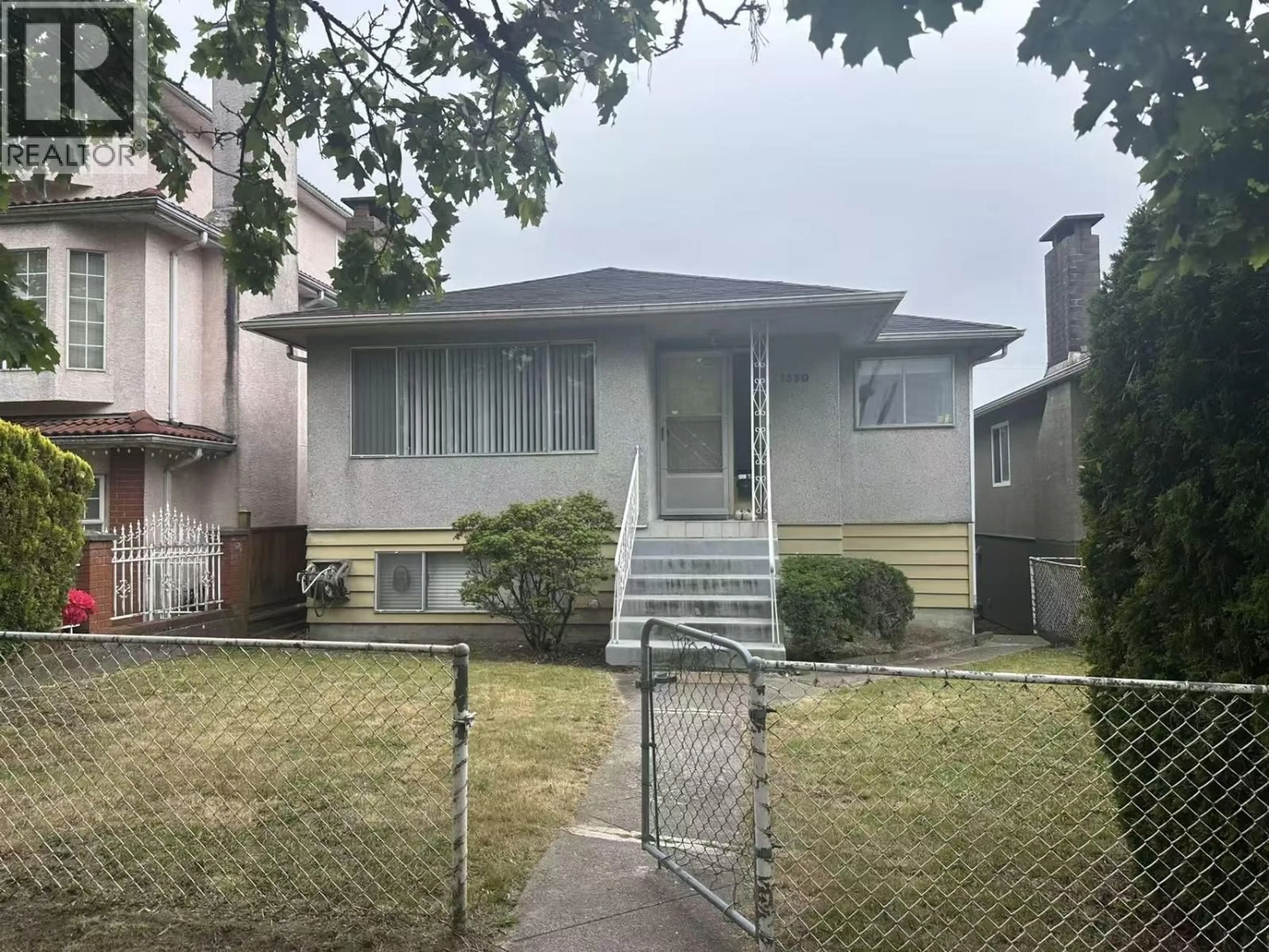 Home with vinyl exterior material, street for 1380 54TH AVENUE, Vancouver British Columbia V5X1M4