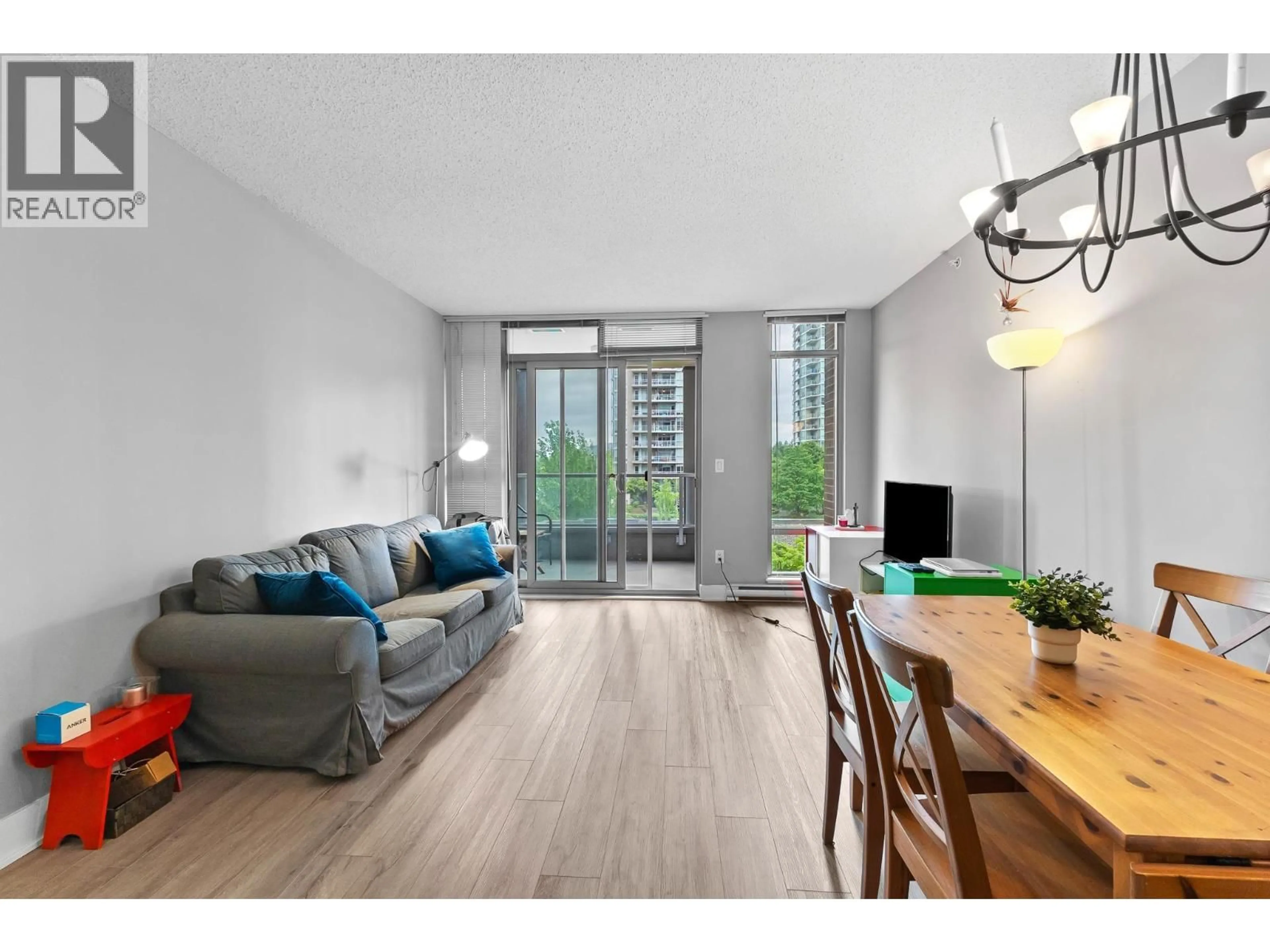 Living room with furniture, wood/laminate floor for 703 - 1155 THE HIGH STREET, Coquitlam British Columbia V3B7W4