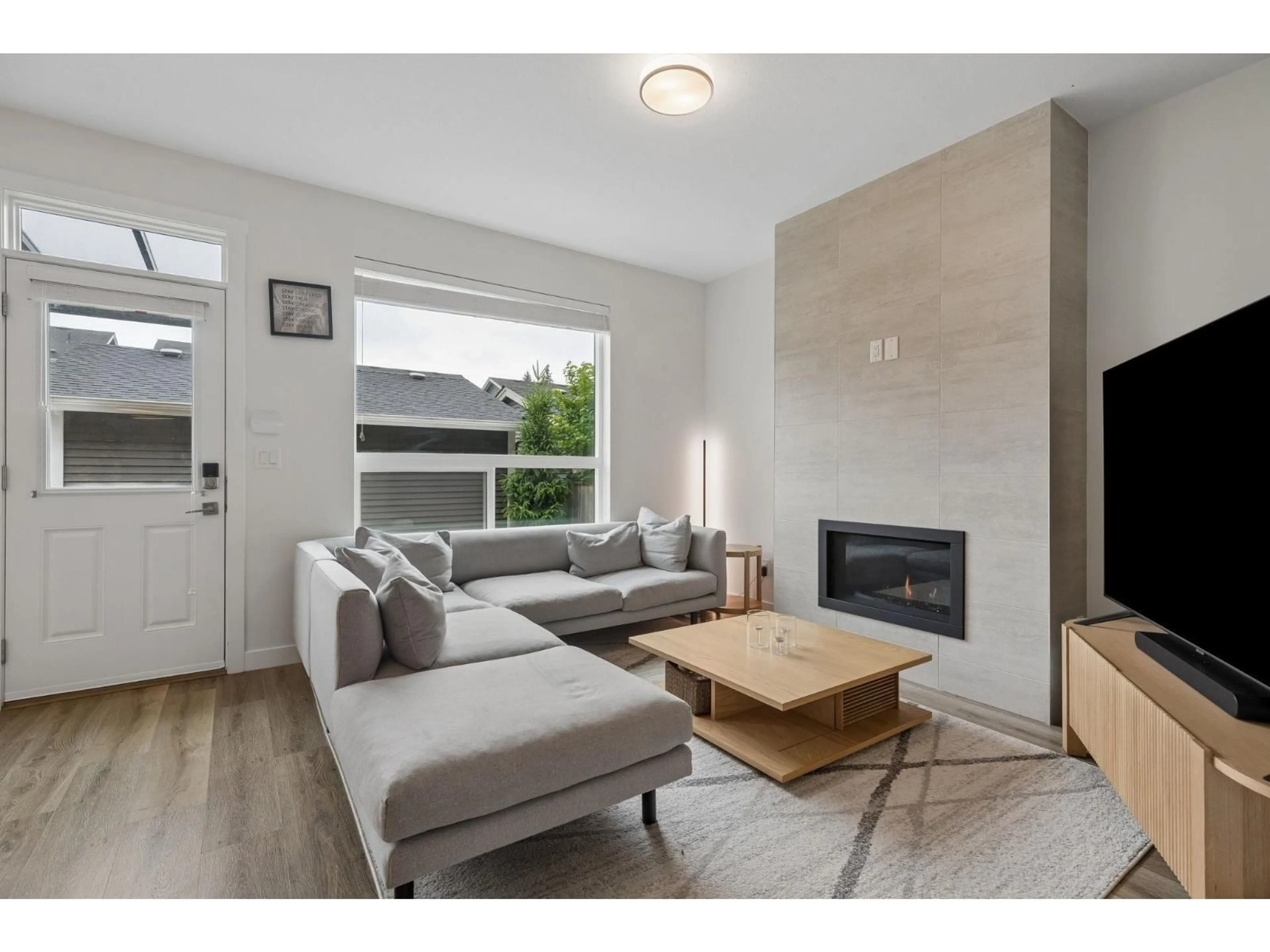 Living room with furniture, wood/laminate floor for 20326 82B AVENUE, Langley British Columbia V2Y0Y8