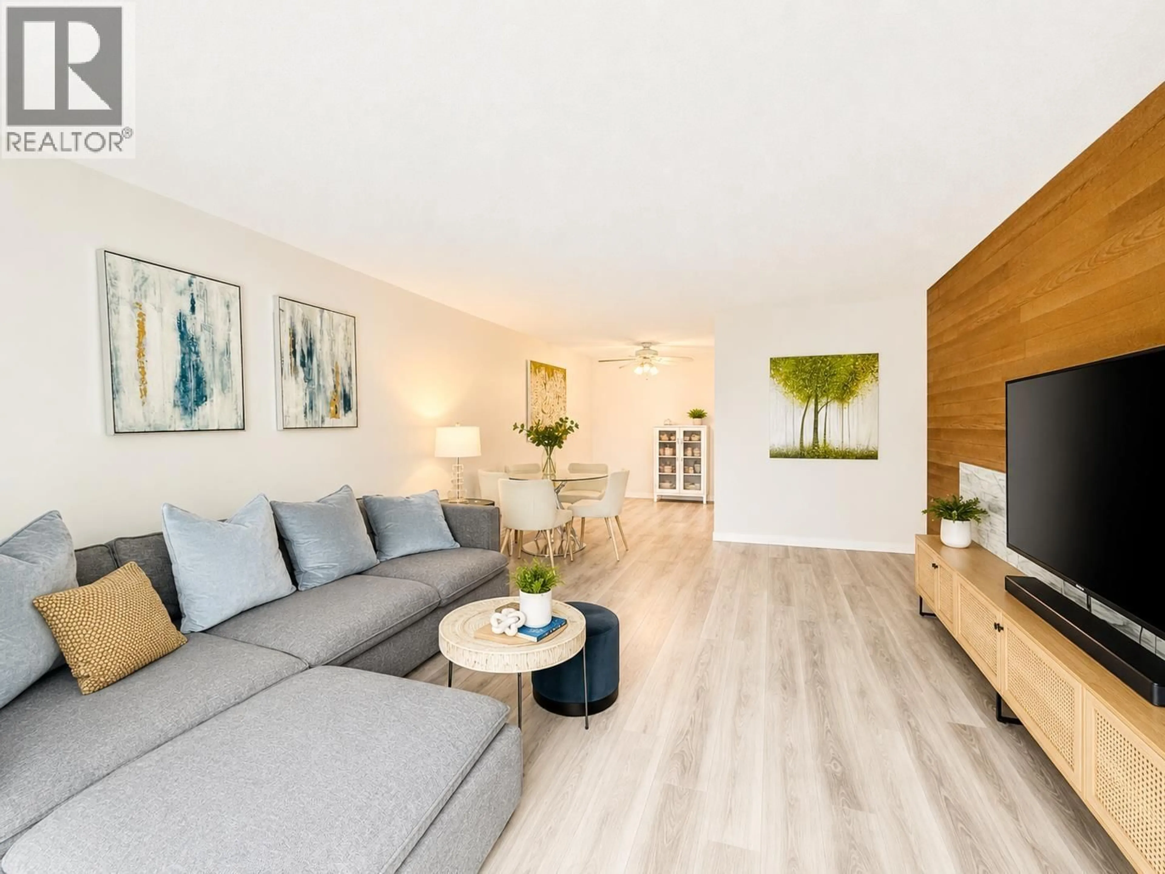 Living room with furniture, wood/laminate floor for 106 - 6669 TELFORD AVENUE, Burnaby British Columbia V5H4A1