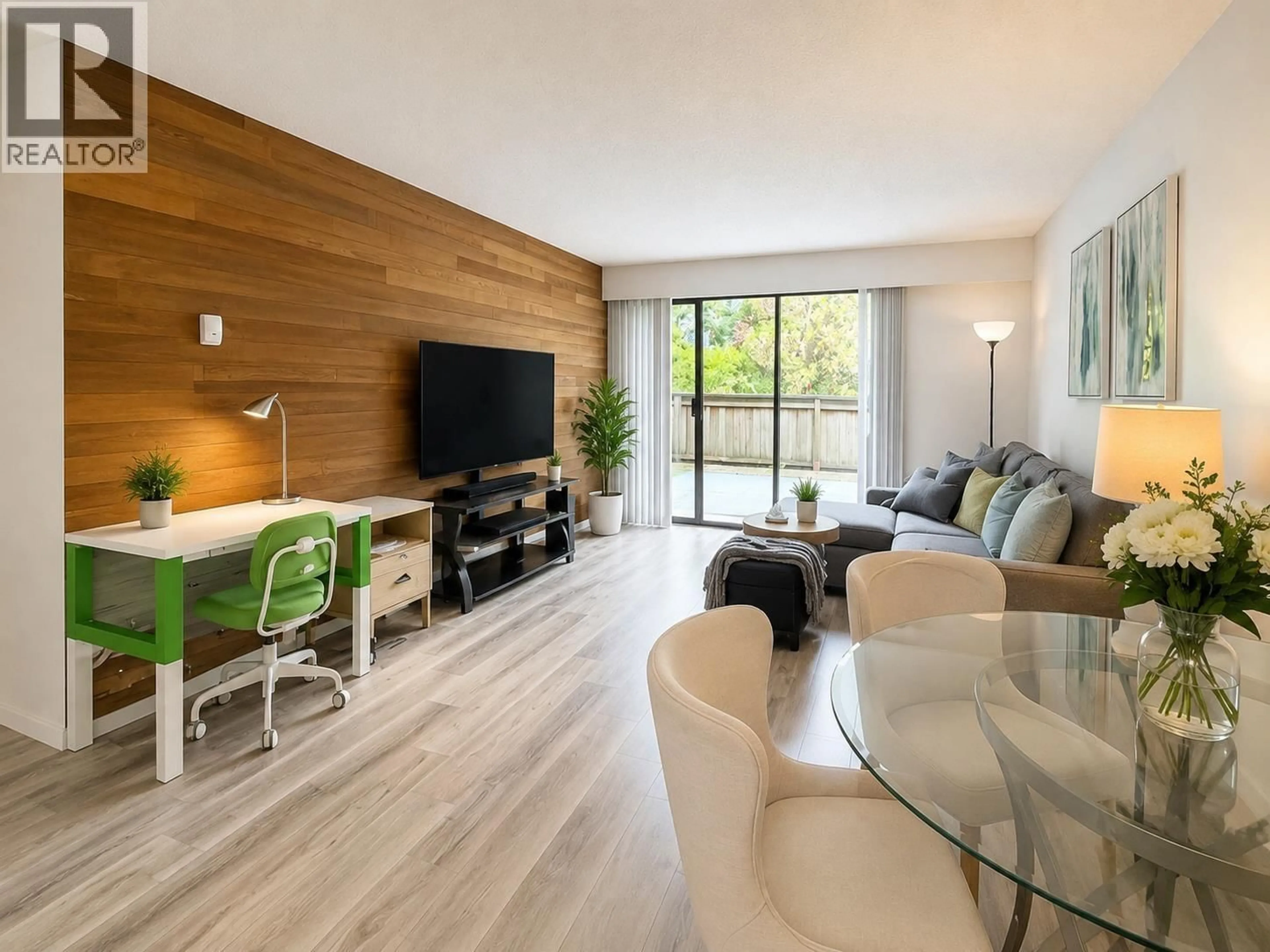 Living room with furniture, wood/laminate floor for 106 - 6669 TELFORD AVENUE, Burnaby British Columbia V5H4A1