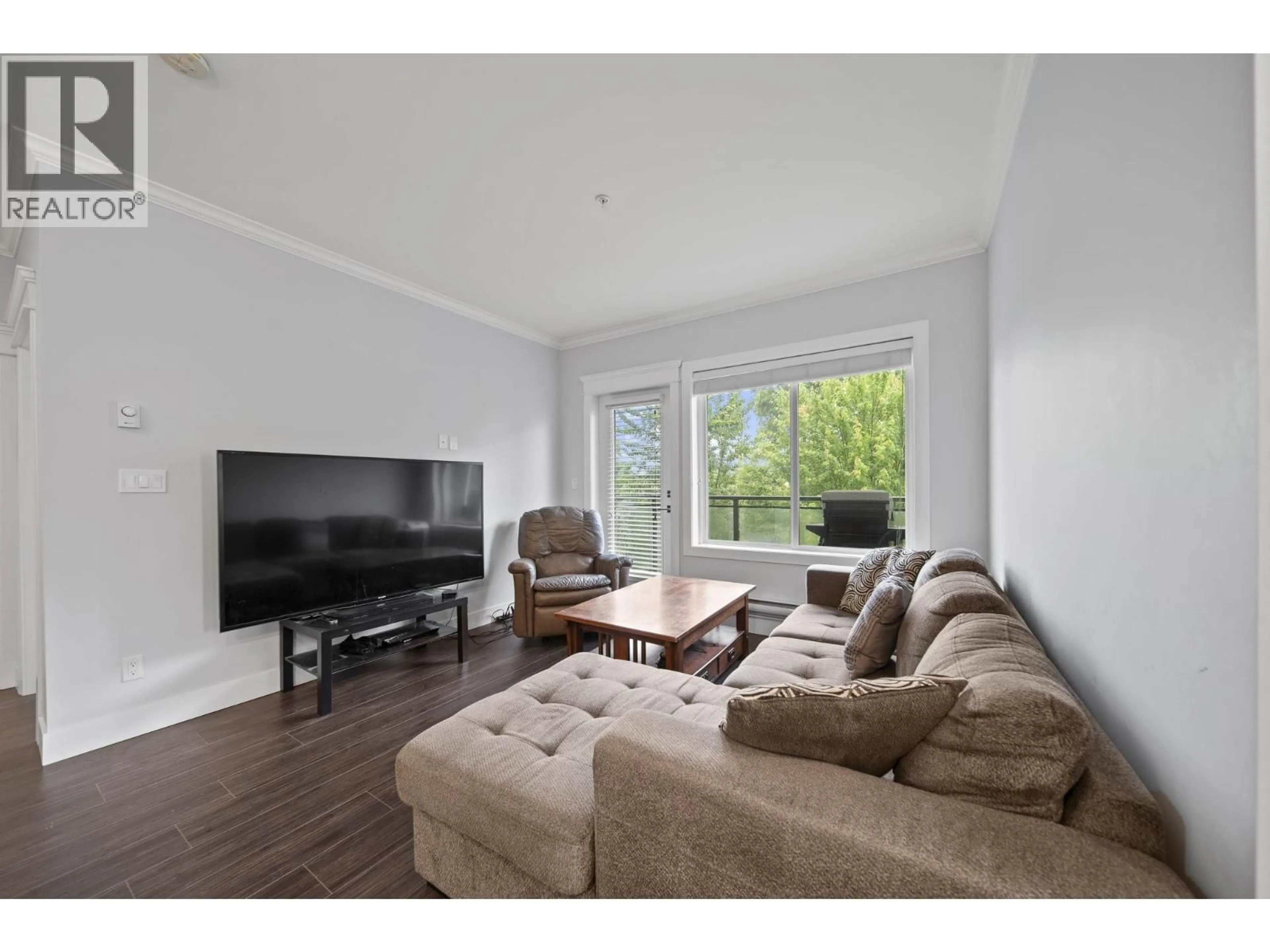 Living room with furniture, wood/laminate floor for 306 - 2229 ATKINS AVENUE, Port Coquitlam British Columbia V3C0H2