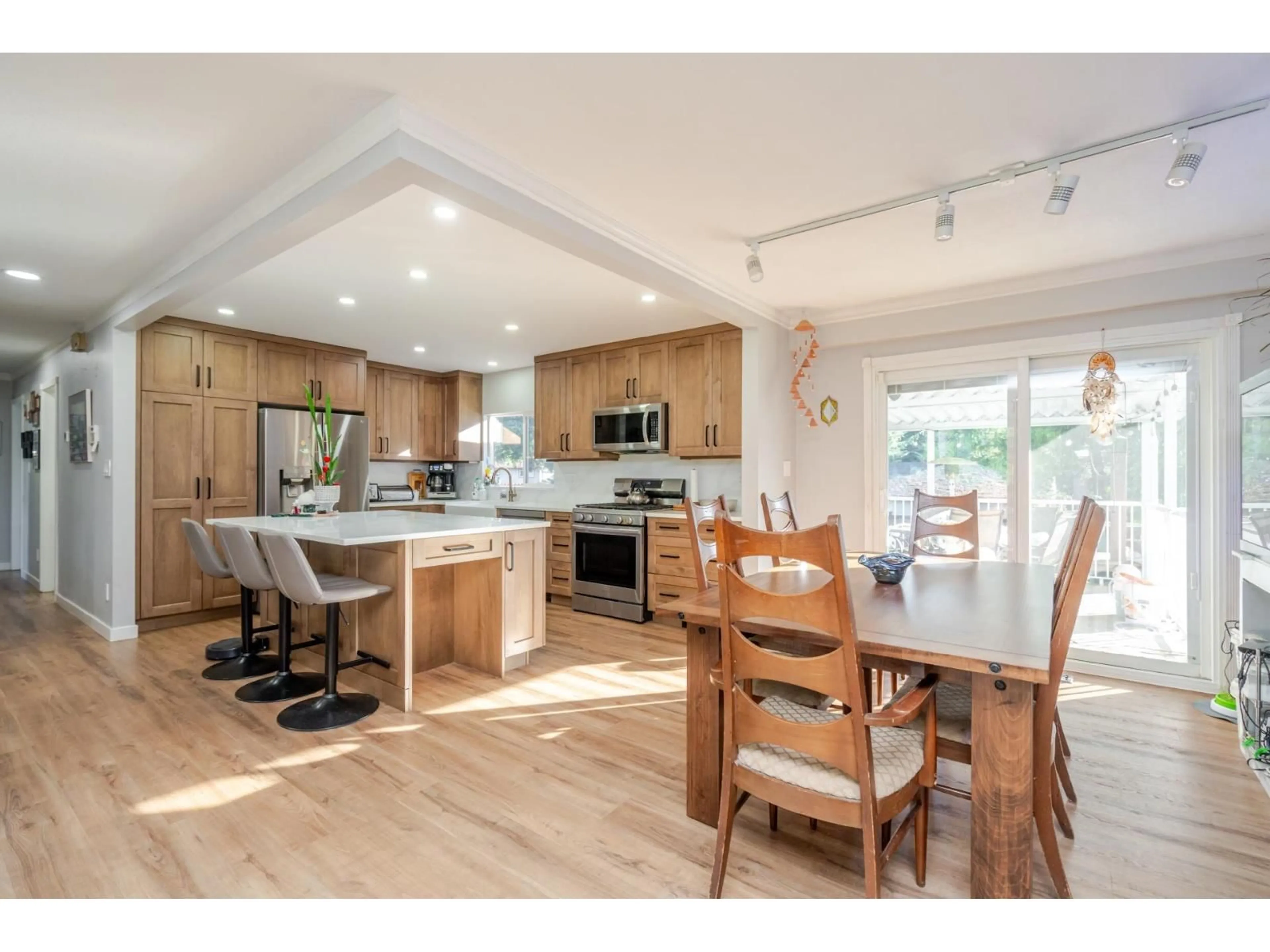 Open concept kitchen, wood/laminate floor for 3924 205B STREET, Langley British Columbia V3A2B3