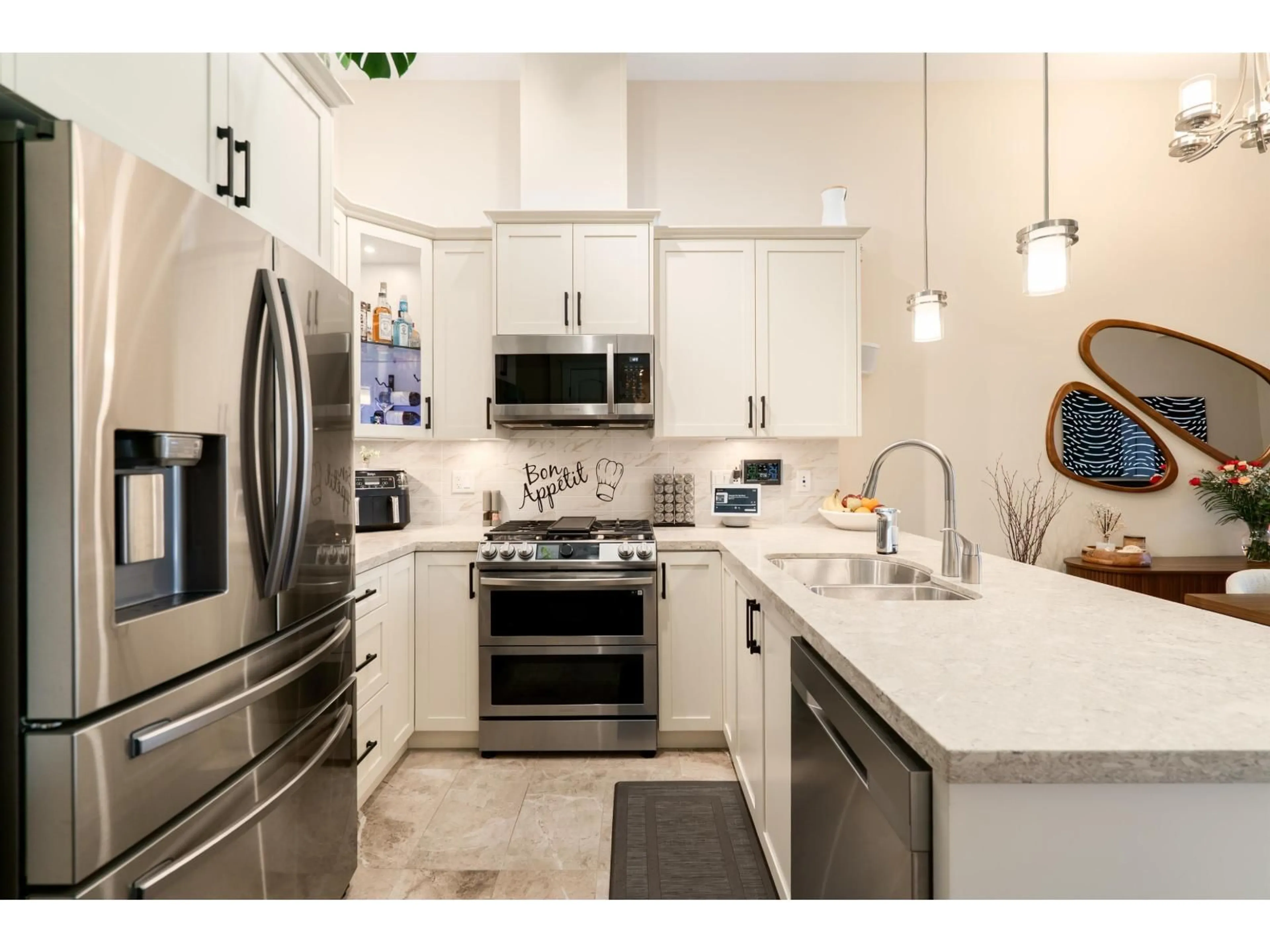 Open concept kitchen, ceramic/tile floor for 601 - 8538 203A STREET, Langley British Columbia V2Y3P9