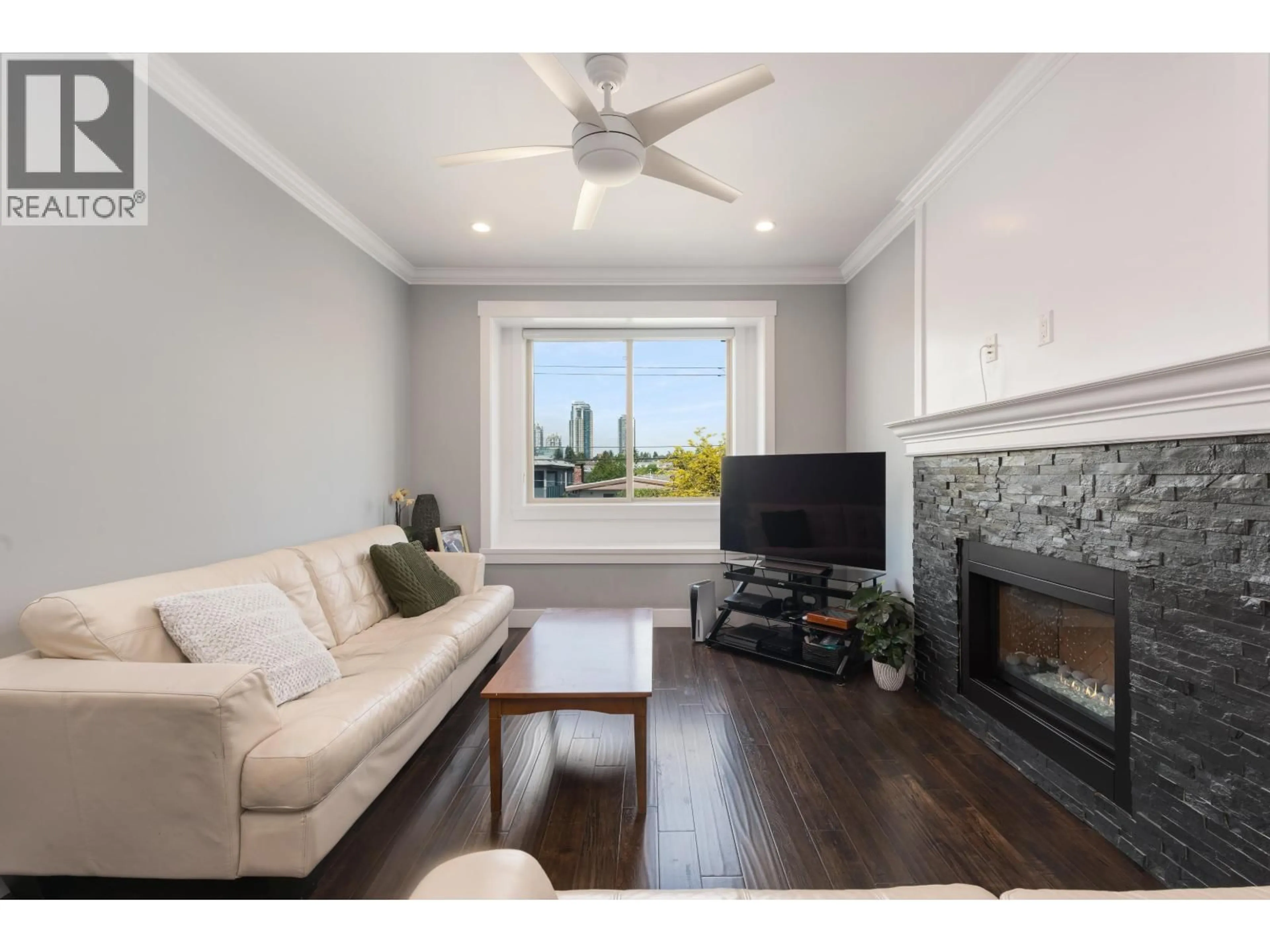 Living room with furniture, wood/laminate floor for 7348 11TH AVENUE, Burnaby British Columbia V3N2N1