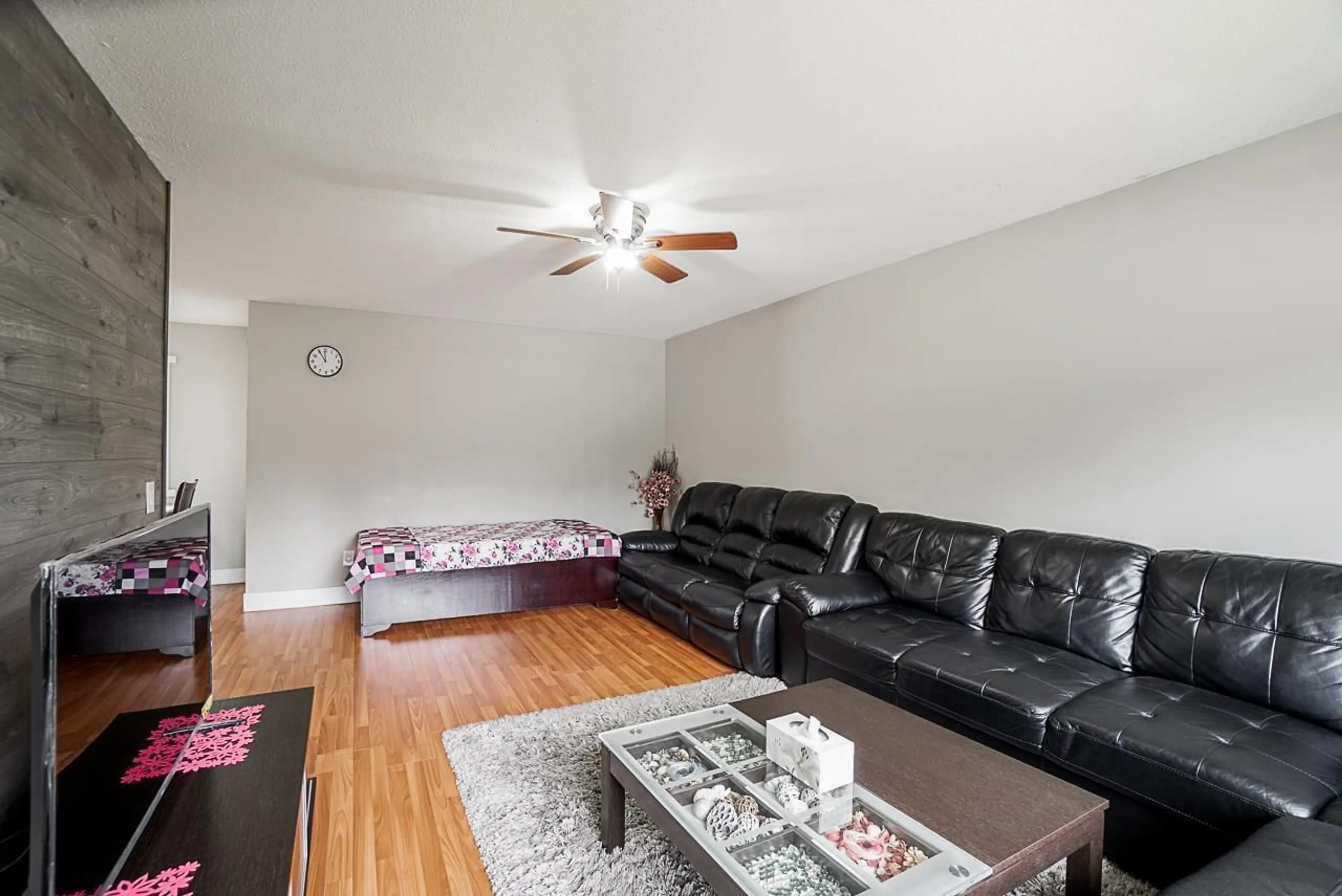 Living room with furniture, wood/laminate floor for 17954 58 AVENUE, Surrey British Columbia V3S1L7