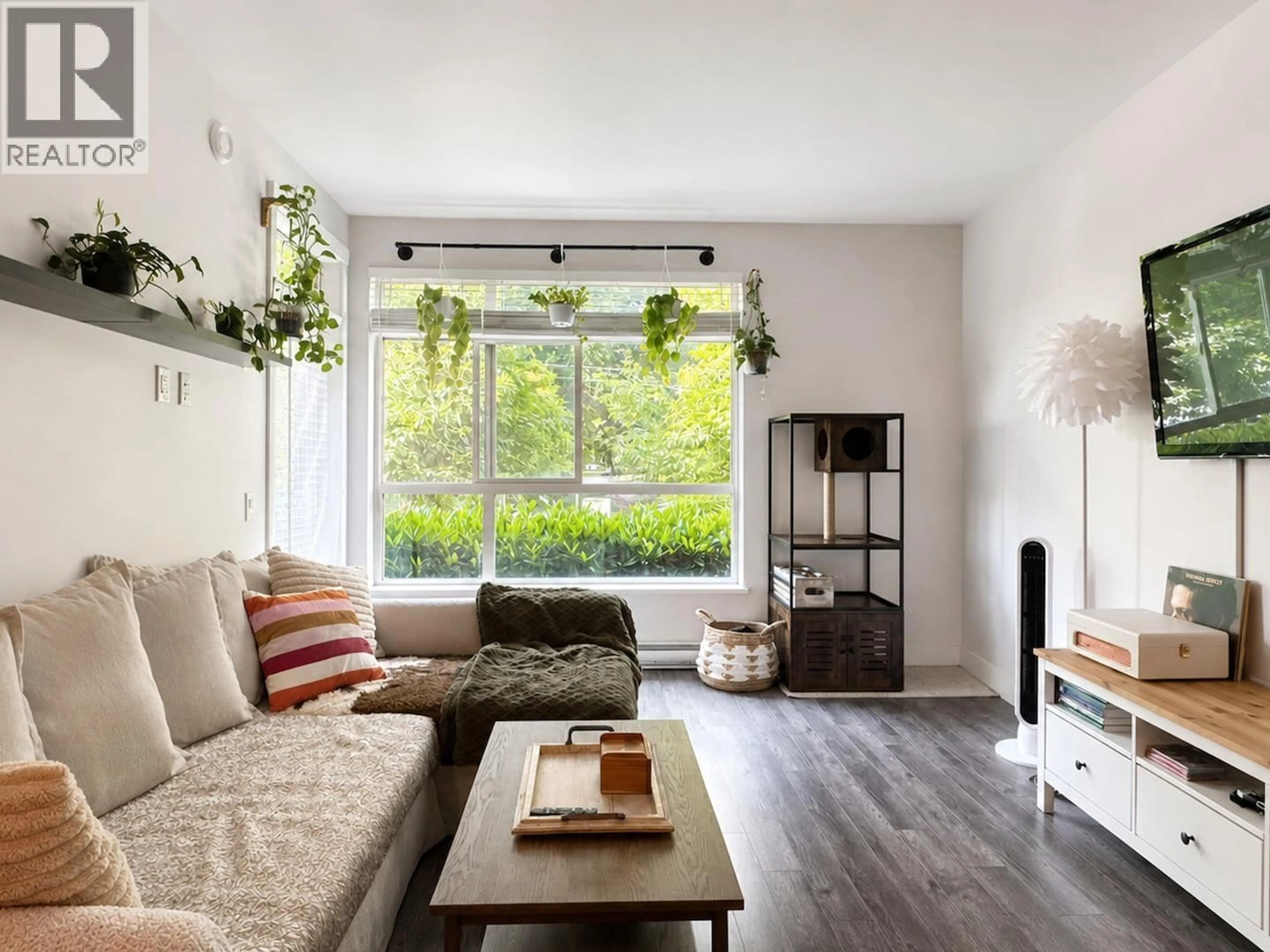 Living room with furniture, wood/laminate floor for 102 - 2436 KELLY AVENUE, Port Coquitlam British Columbia V3C0G9