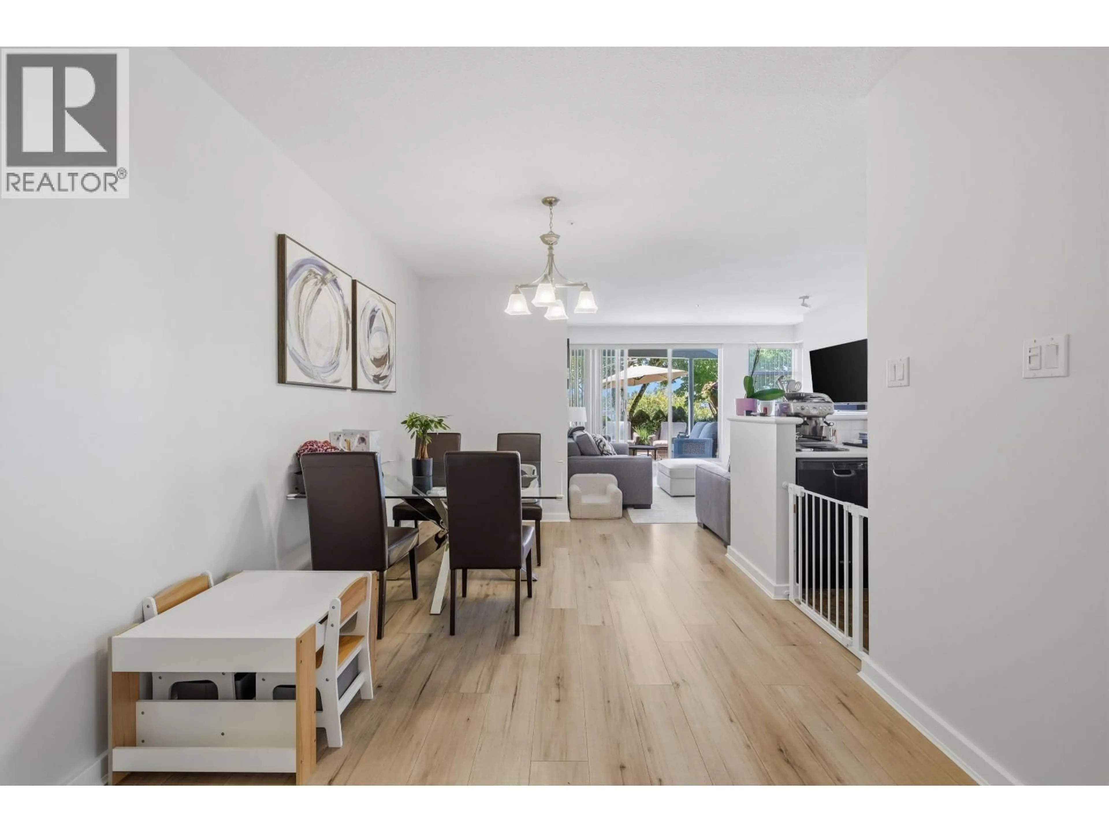 Living room with furniture, wood/laminate floor for 104 - 2080 KENT SOUTH AVENUE, Vancouver British Columbia V5P4X2