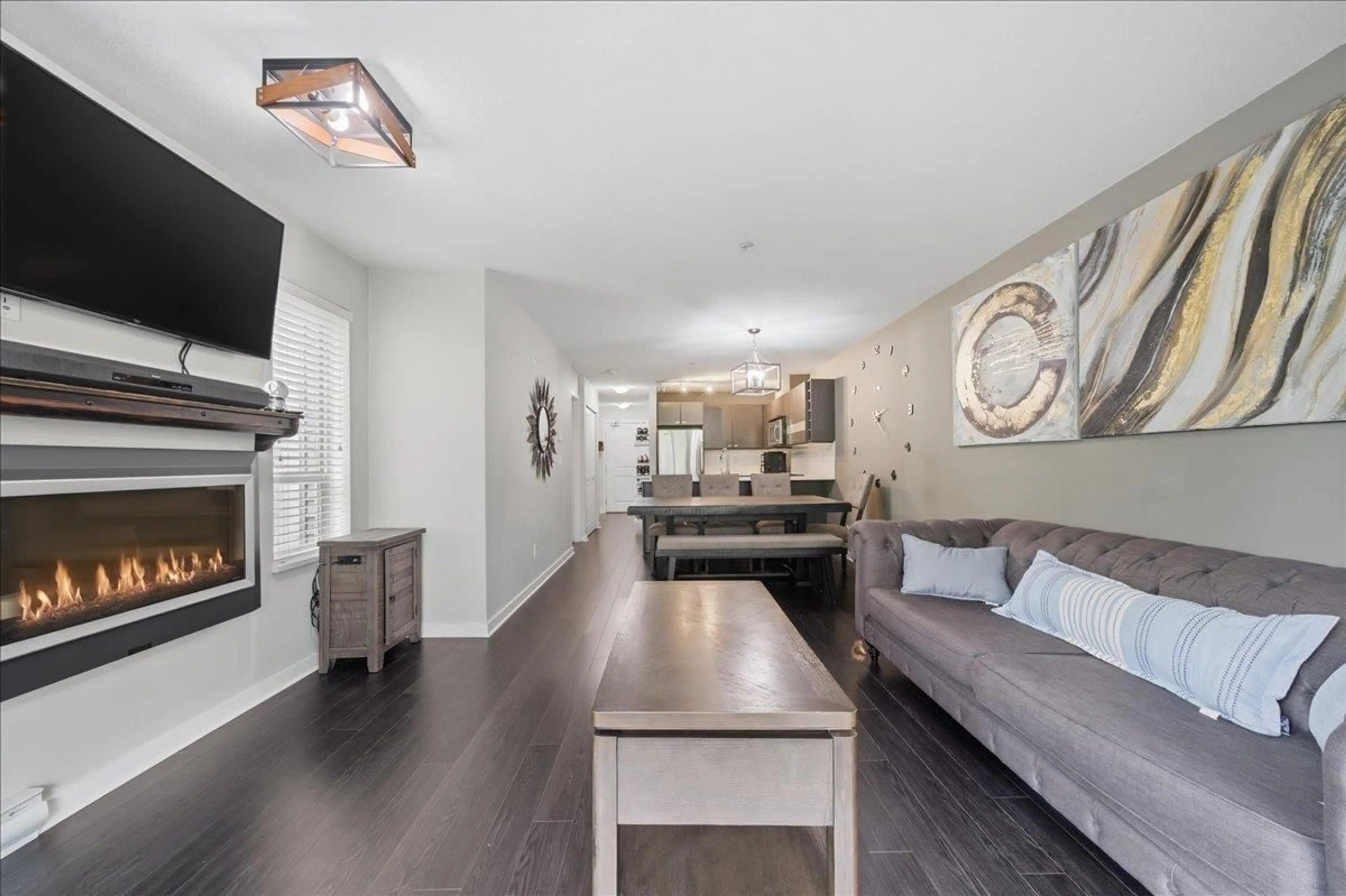 Living room with furniture, wood/laminate floor for 215 - 21009 56 AVENUE, Langley British Columbia V3A0C9