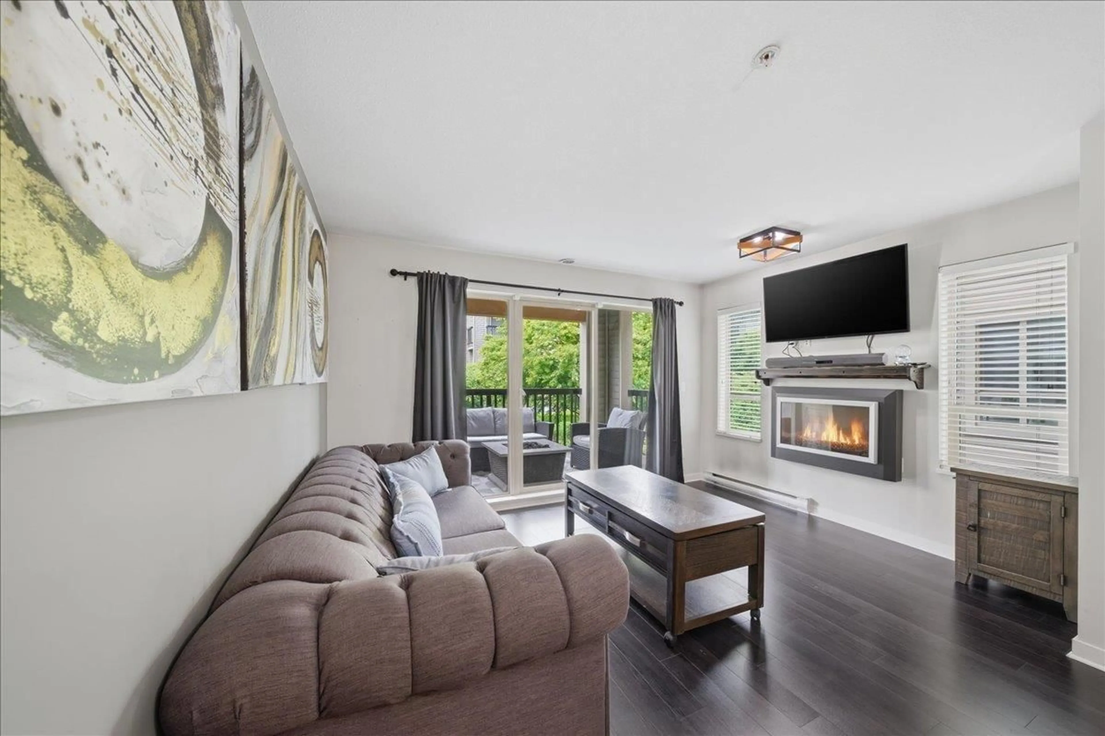 Living room with furniture, wood/laminate floor for 215 - 21009 56 AVENUE, Langley British Columbia V3A0C9