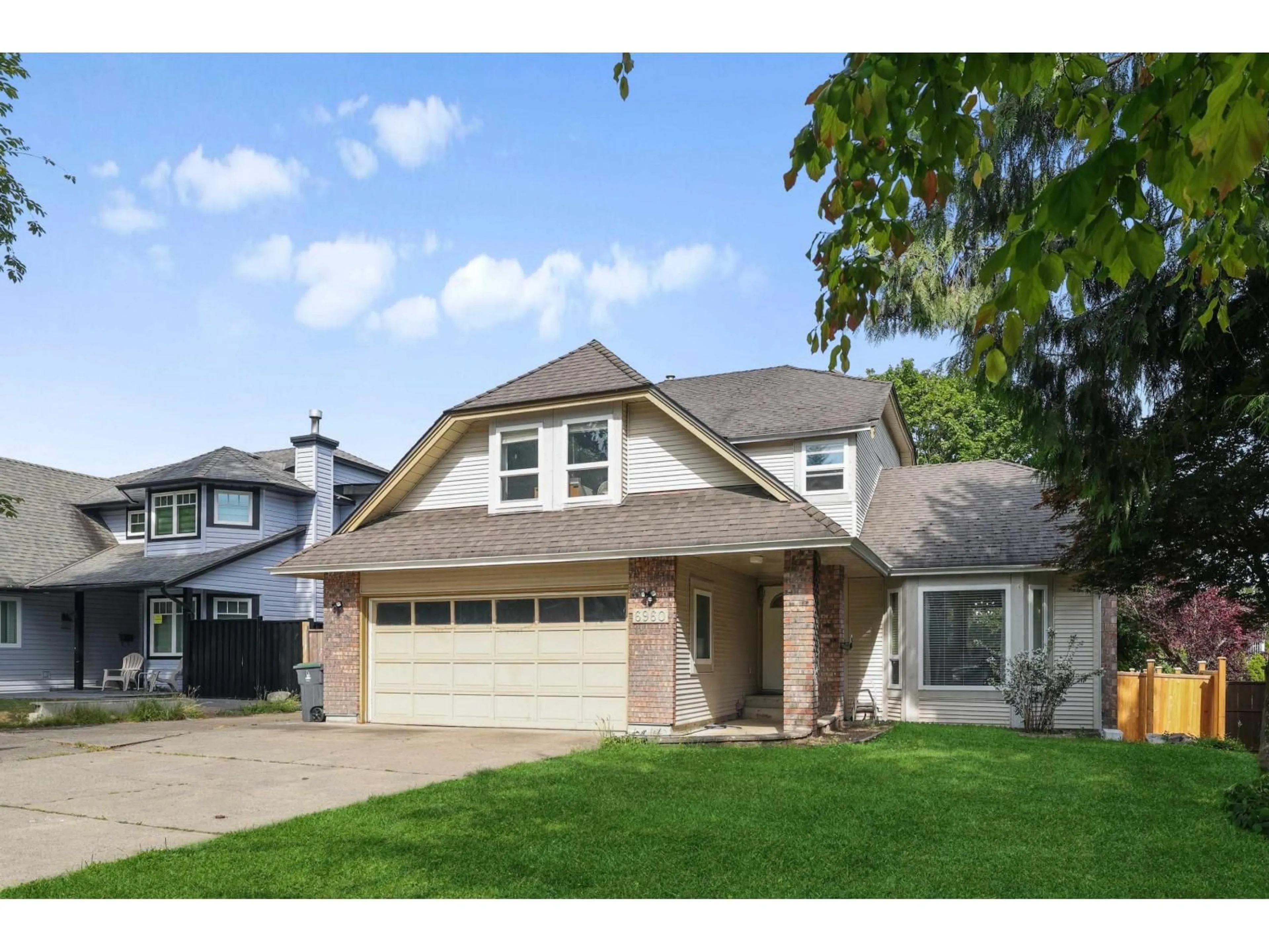 Home with vinyl exterior material, street for 6960 143A STREET, Surrey British Columbia V3W0E3