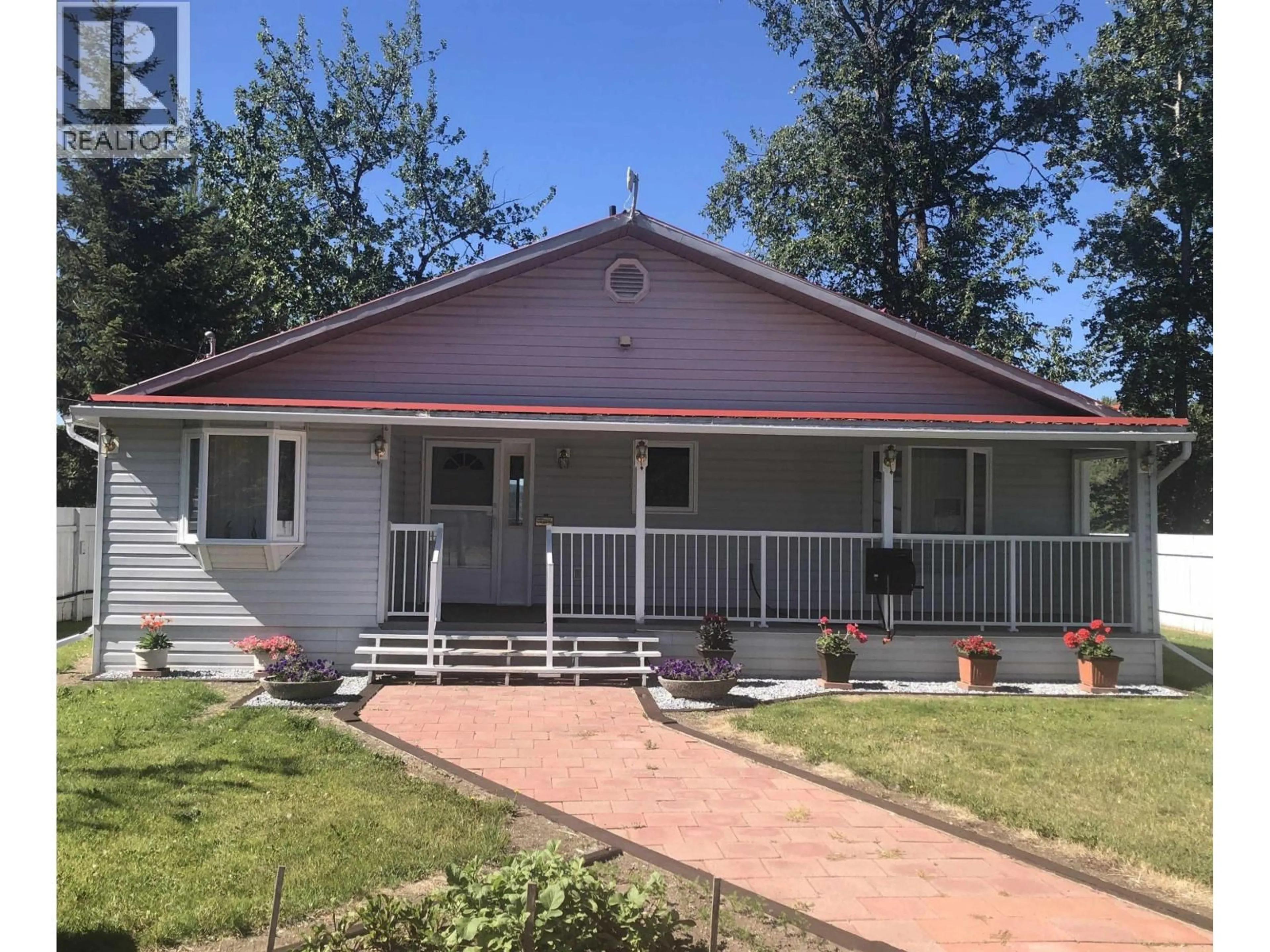 Home with vinyl exterior material, street for 7013 PETERSON ROAD, Fraser Lake British Columbia V0J1S0