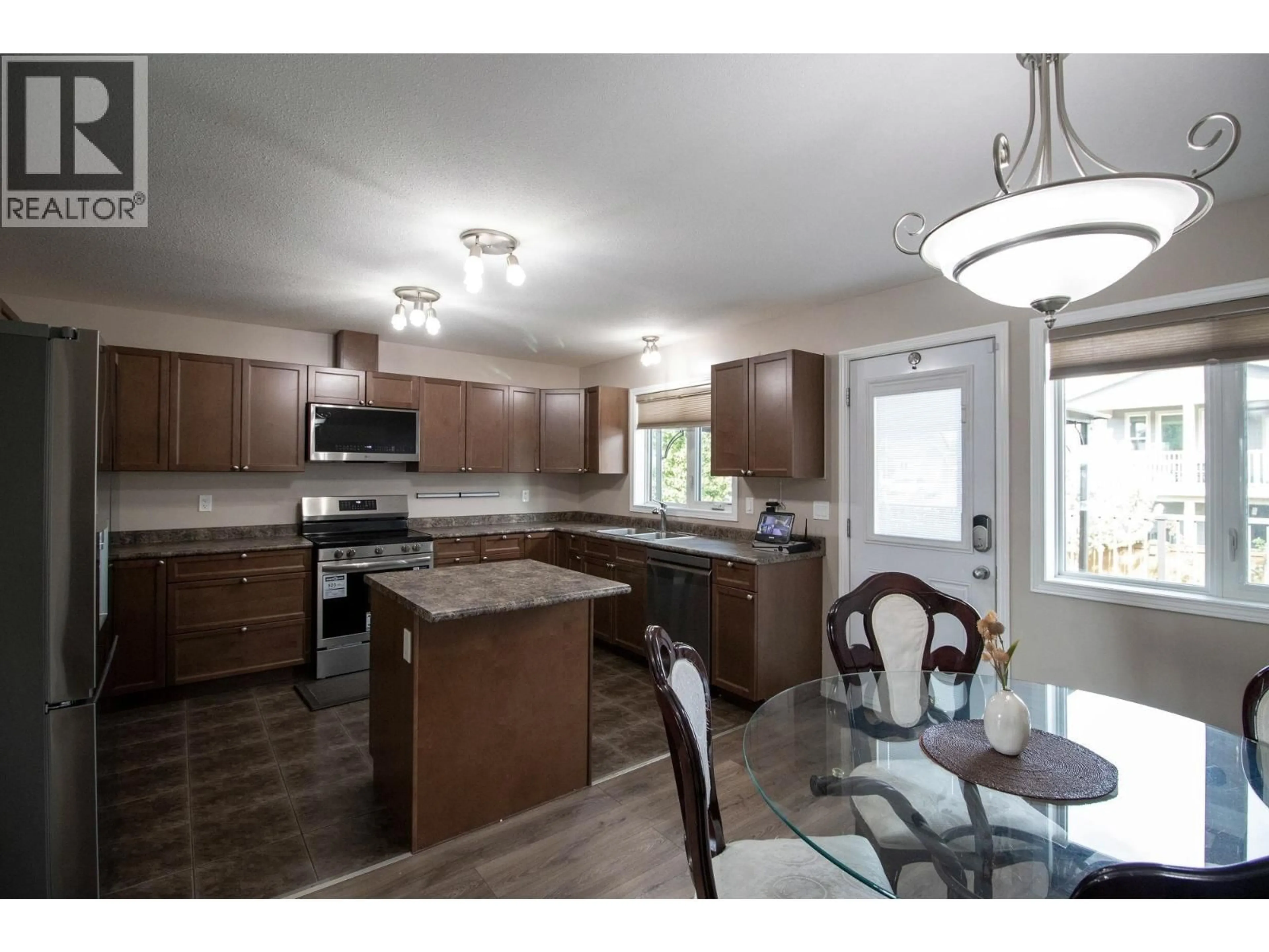 Open concept kitchen, unknown for 10711 109A STREET, Fort St. John British Columbia V1J0L2