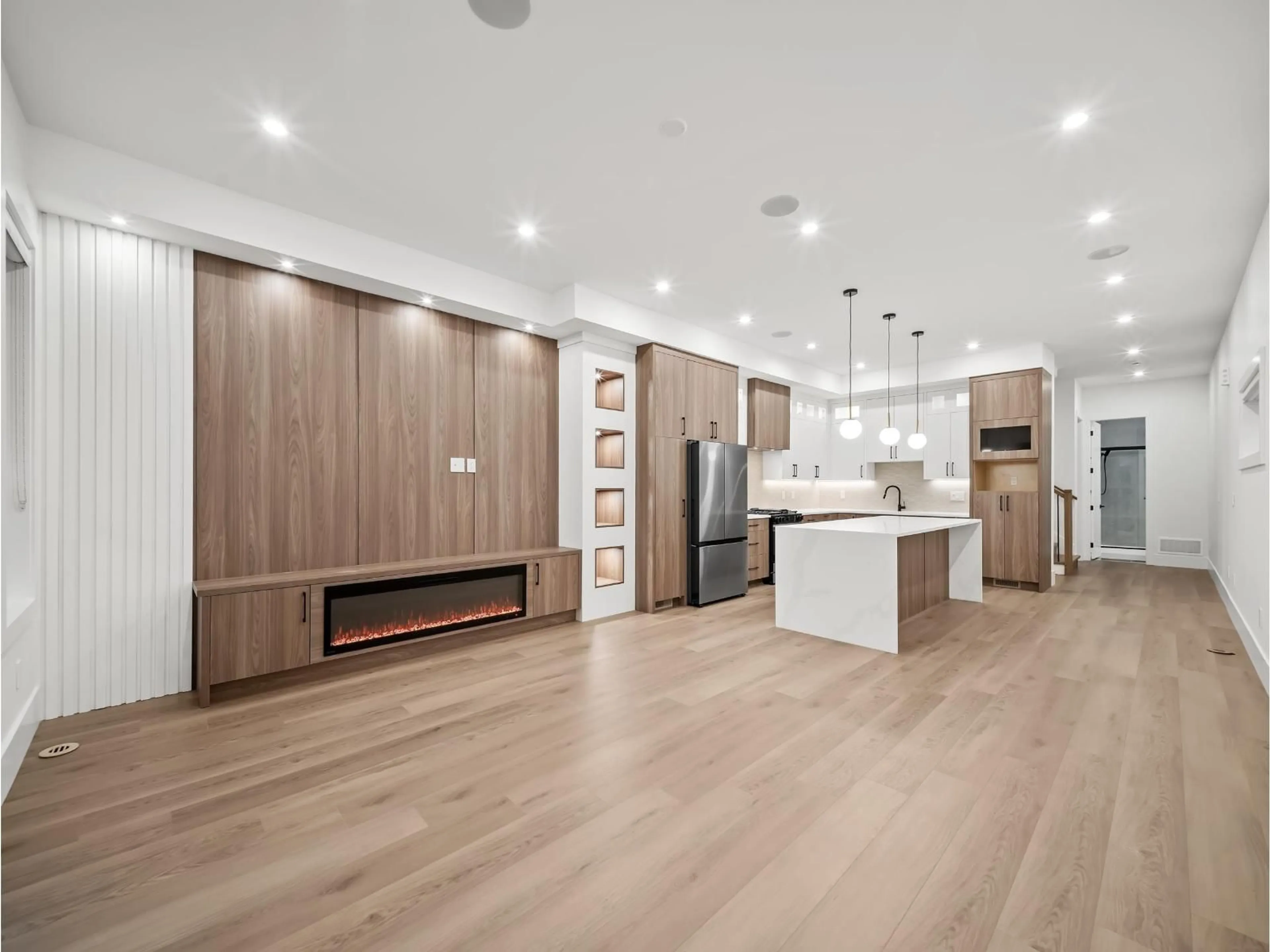 Open concept kitchen, wood/laminate floor for 102 - 11480 138A STREET, Surrey British Columbia V3R0J3