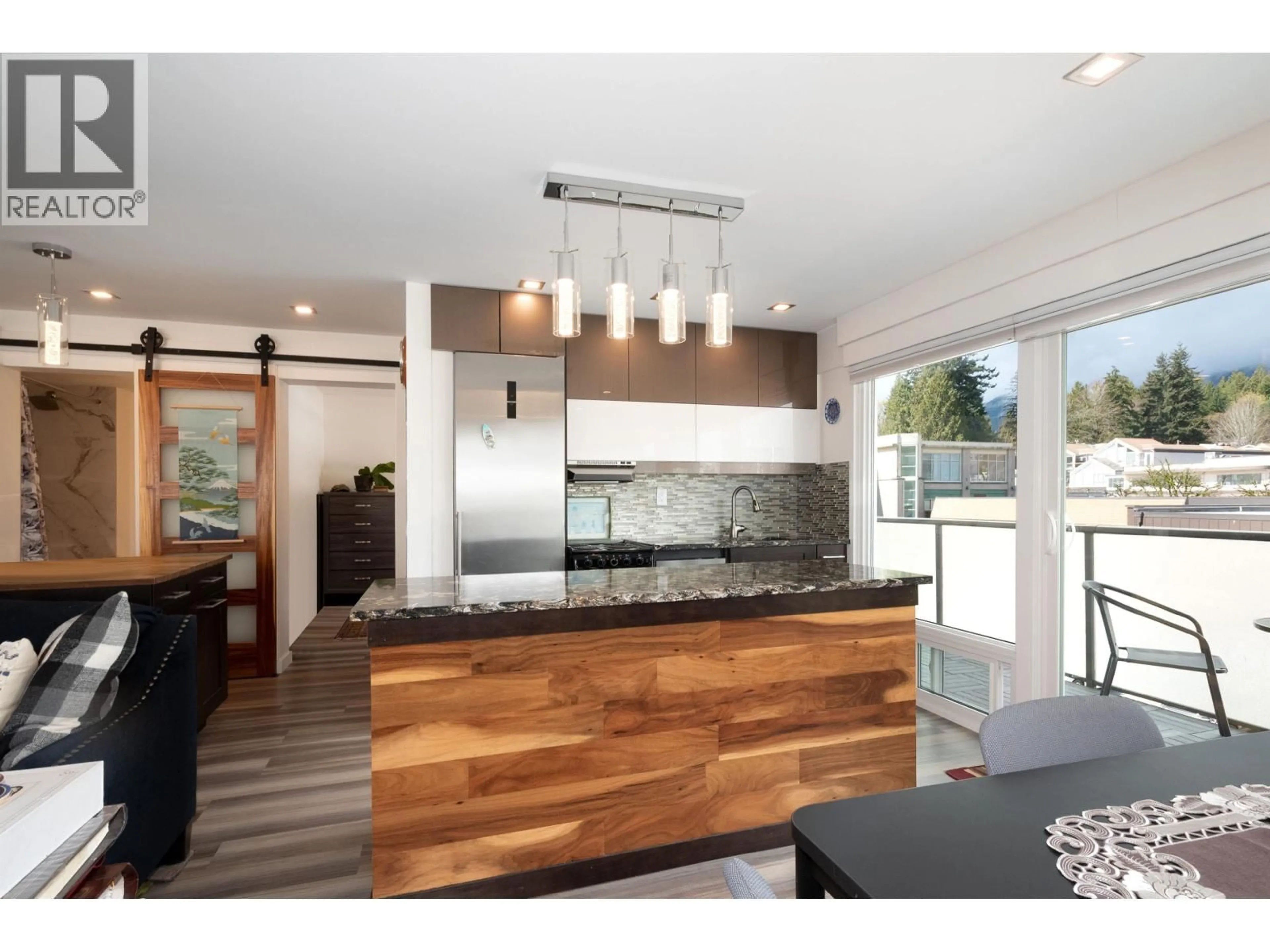 Contemporary kitchen, wood/laminate floor for 303 - 1845 BELLEVUE AVENUE, West Vancouver British Columbia V7V1B2