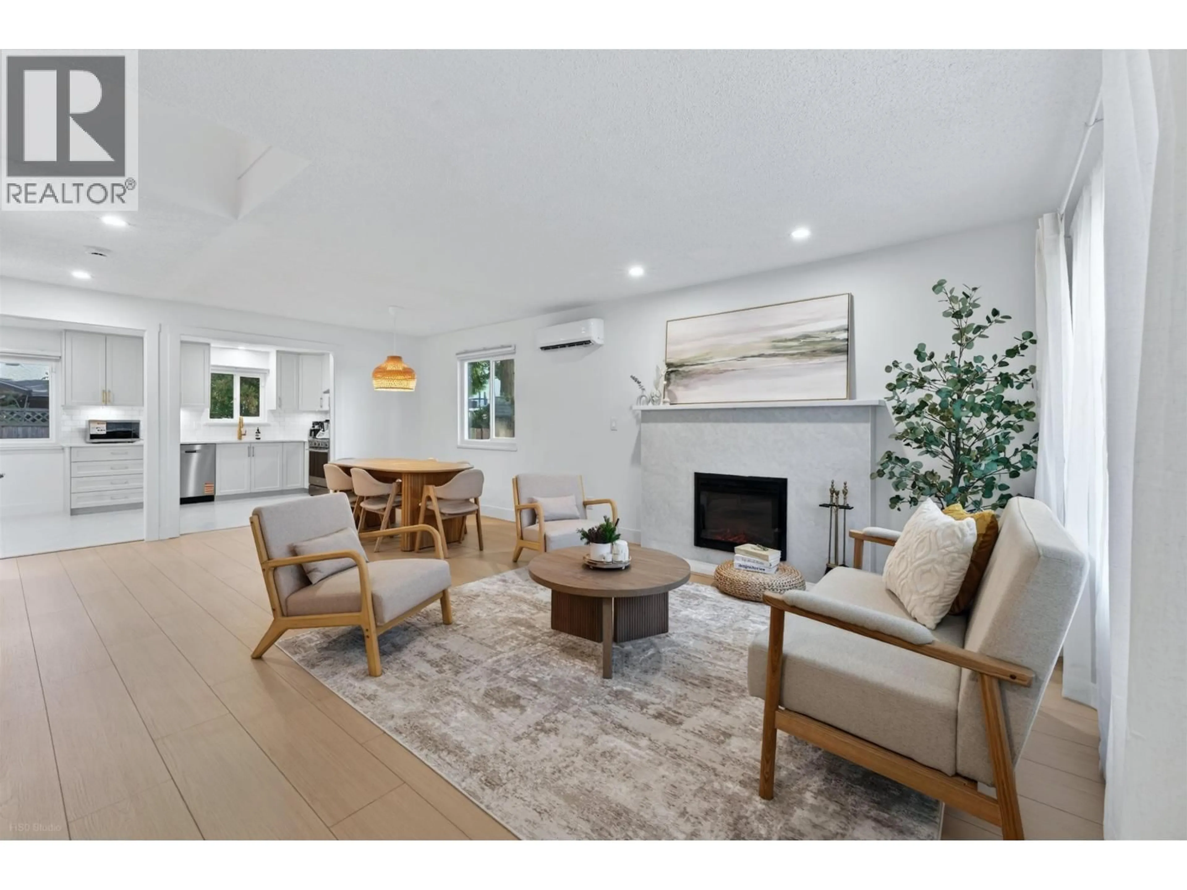 Living room with furniture, wood/laminate floor for 6020 COMSTOCK ROAD, Richmond British Columbia V7C2X4