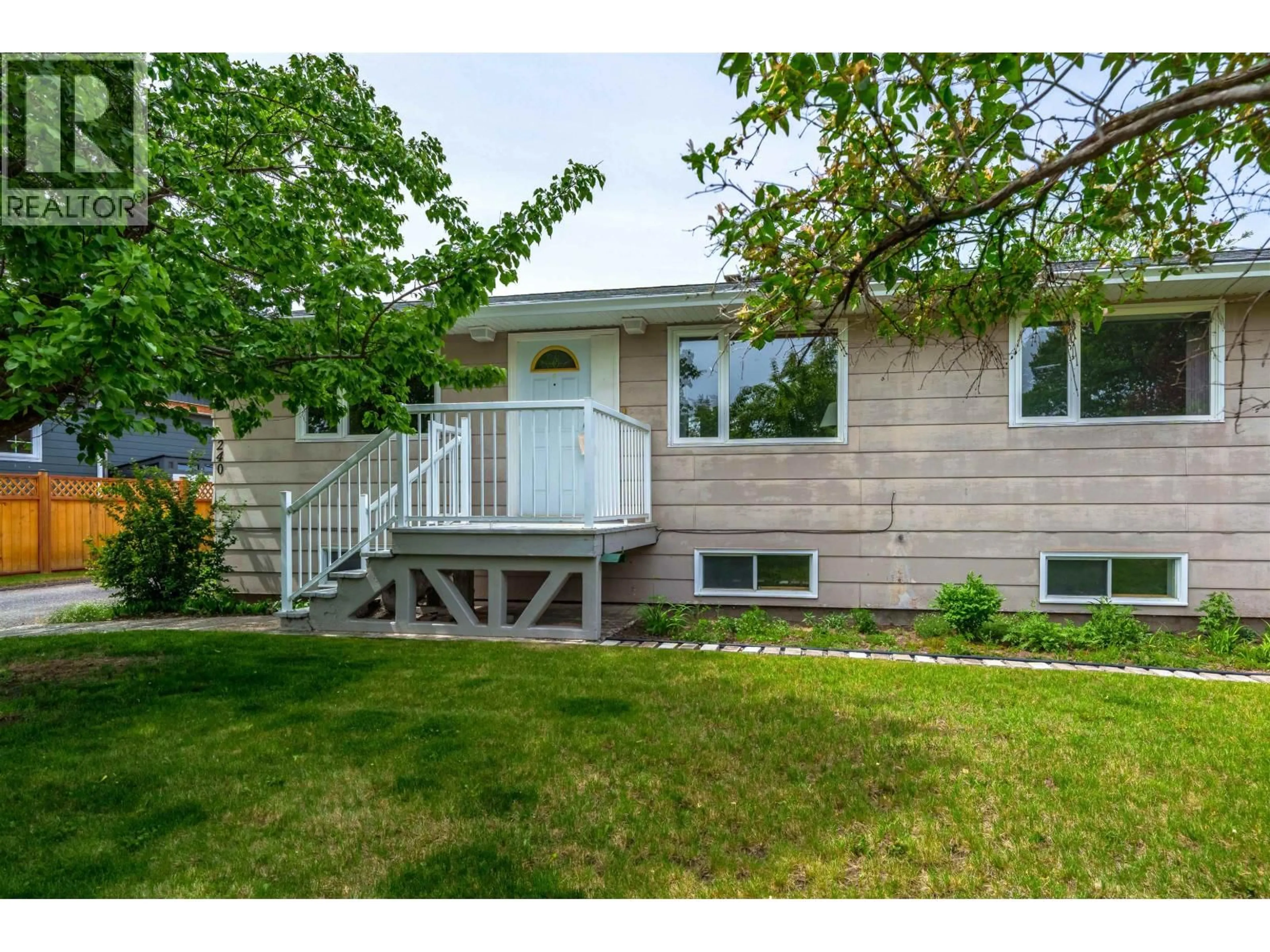 Home with vinyl exterior material, street for 240 DOGWOOD AVENUE, 100 Mile House British Columbia V0K2E0