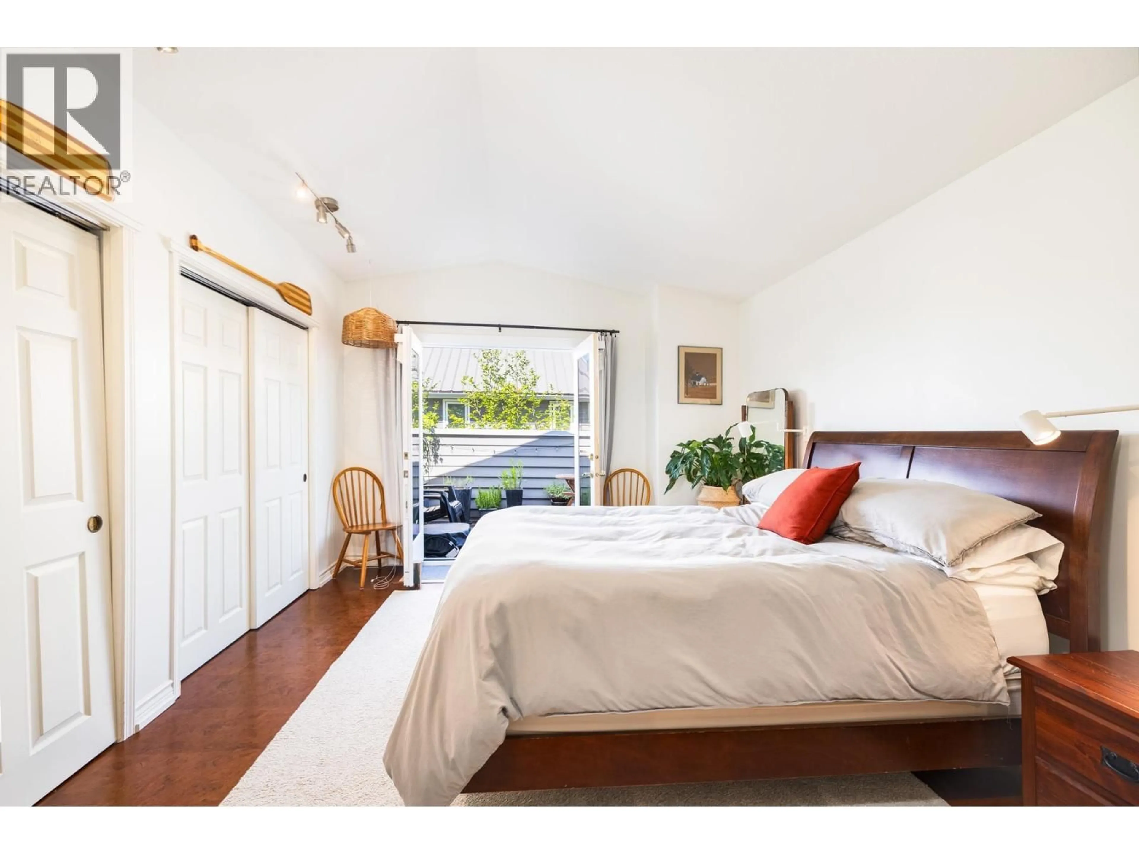 Bedroom with bed, wood/laminate floor for 303 - 1528 BOWSER AVENUE, North Vancouver British Columbia V7P2Y3